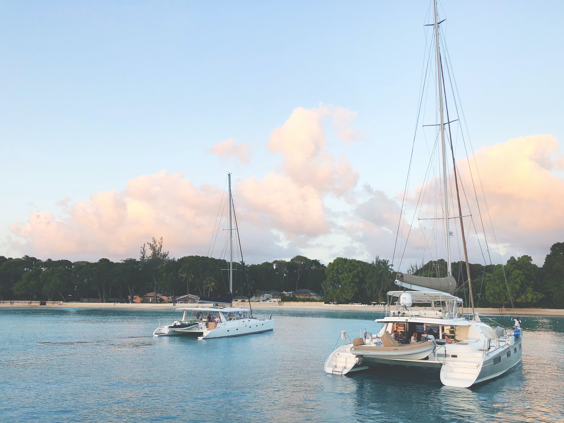 Two small yacht boats anchored just offshore