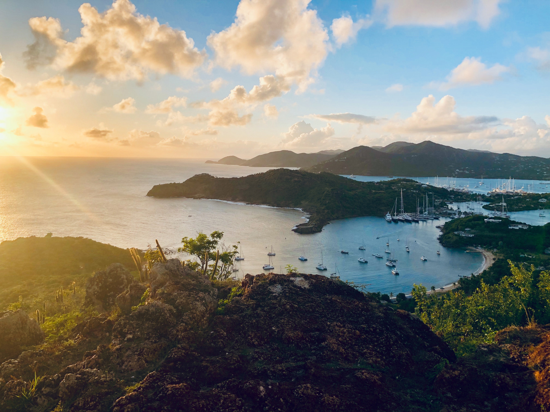 Sunset at Shirley Heights with a view of boats on the sea