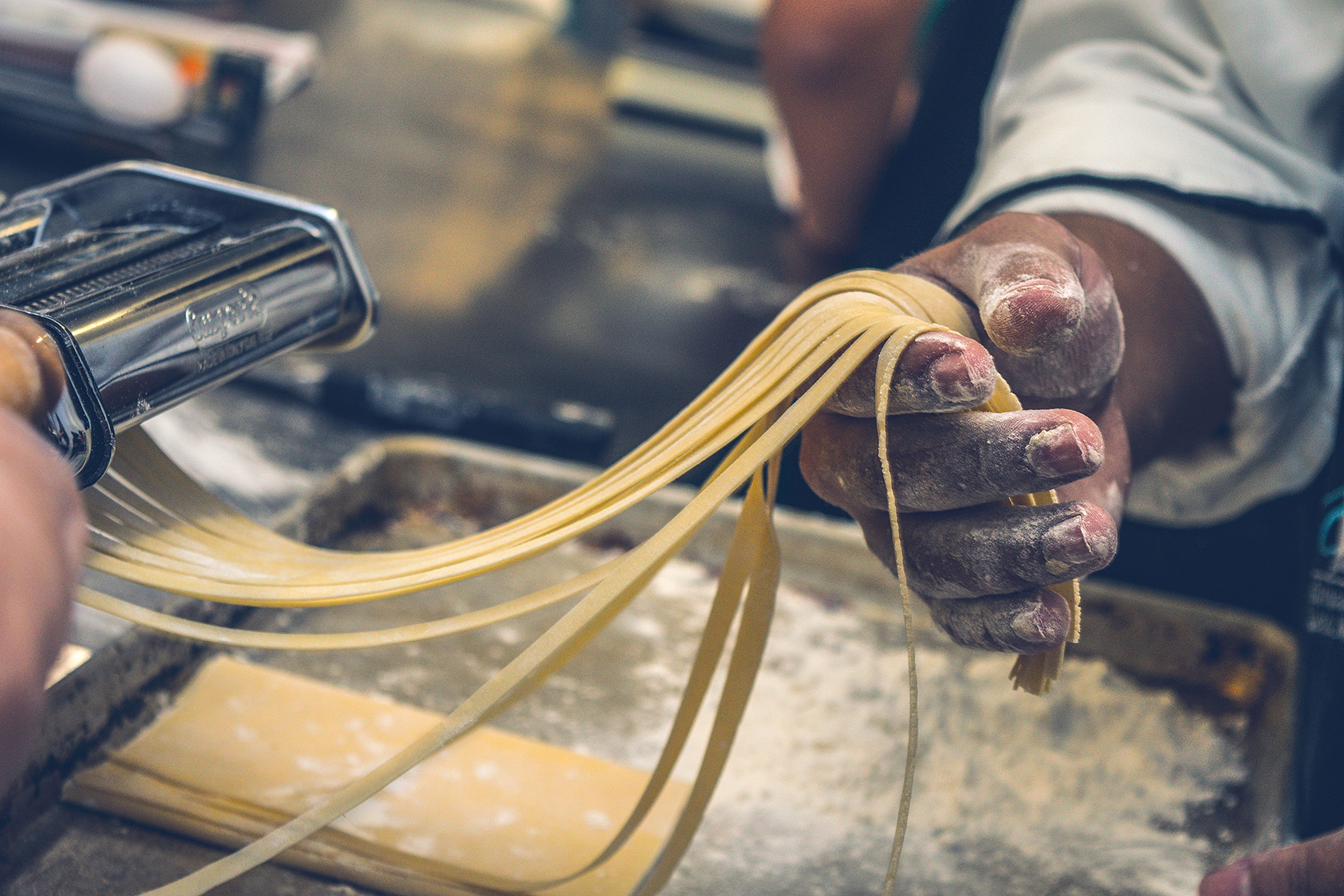 Europe, Italy, chefs hands making pasta