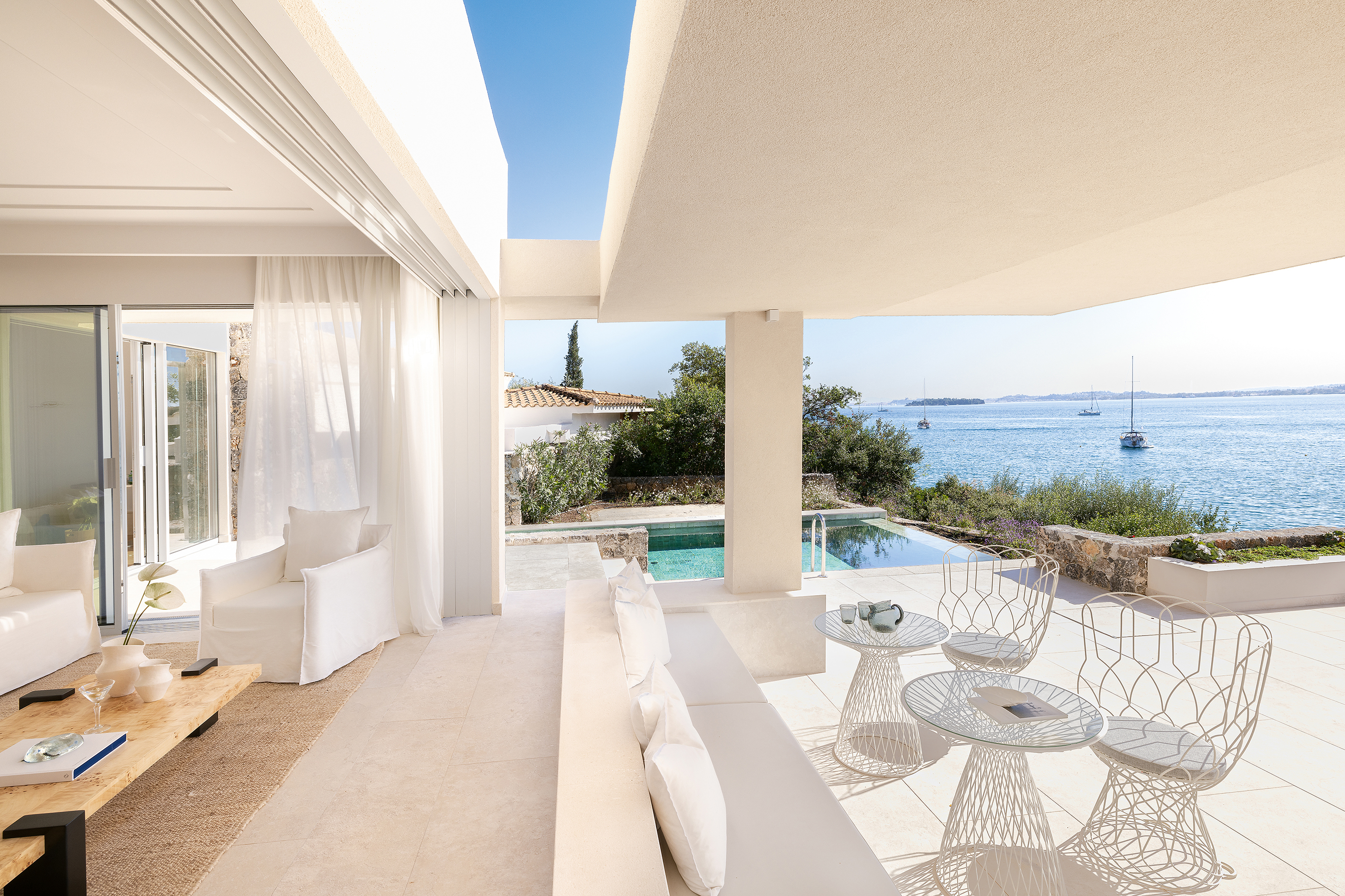 Luxurious suite at Grecotel Corfu Imperial with private pool, modern outdoor lounge, and panoramic sea view.