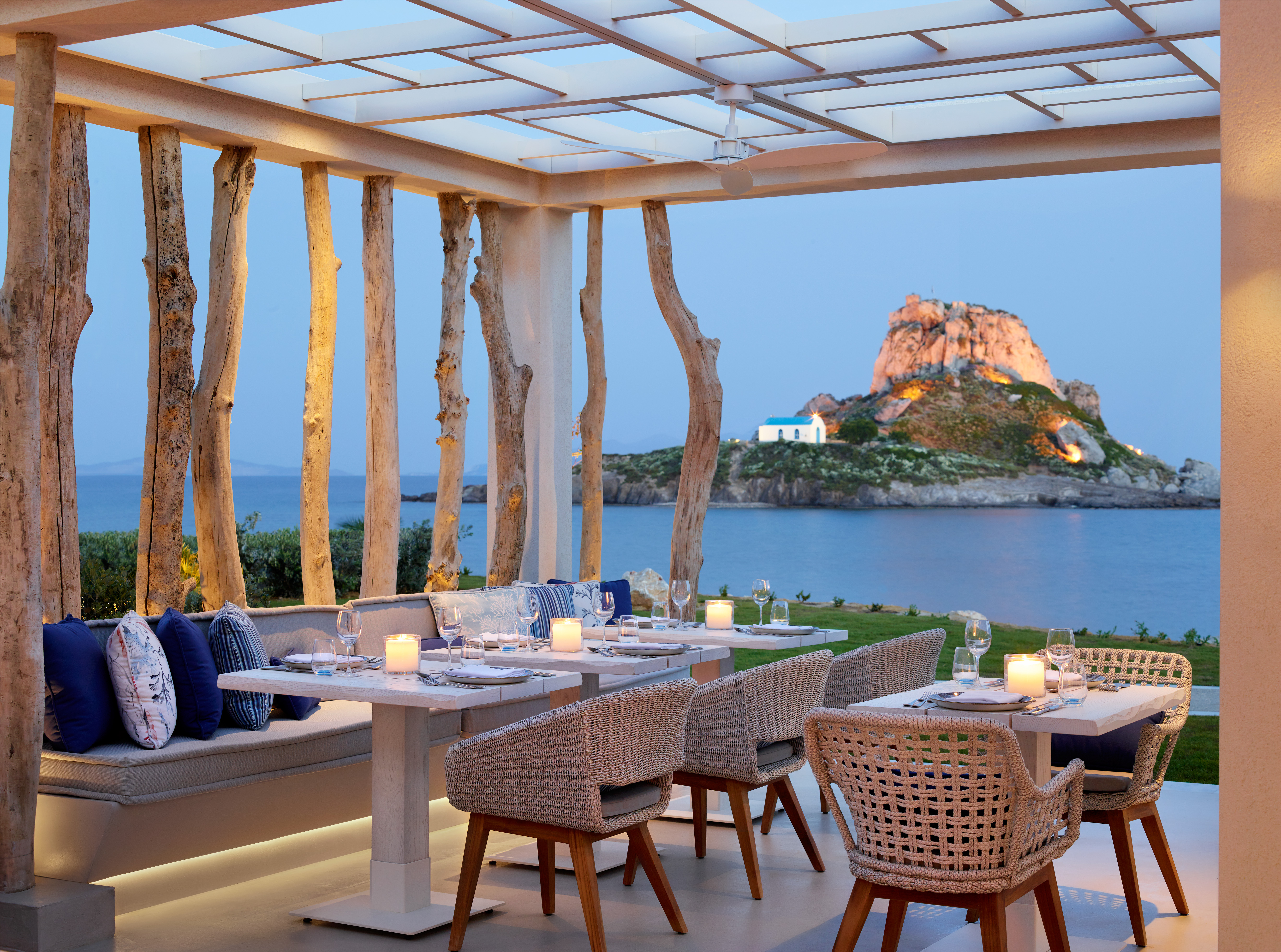 Terrace dining at Ouzo Restaurant with a view of the sea