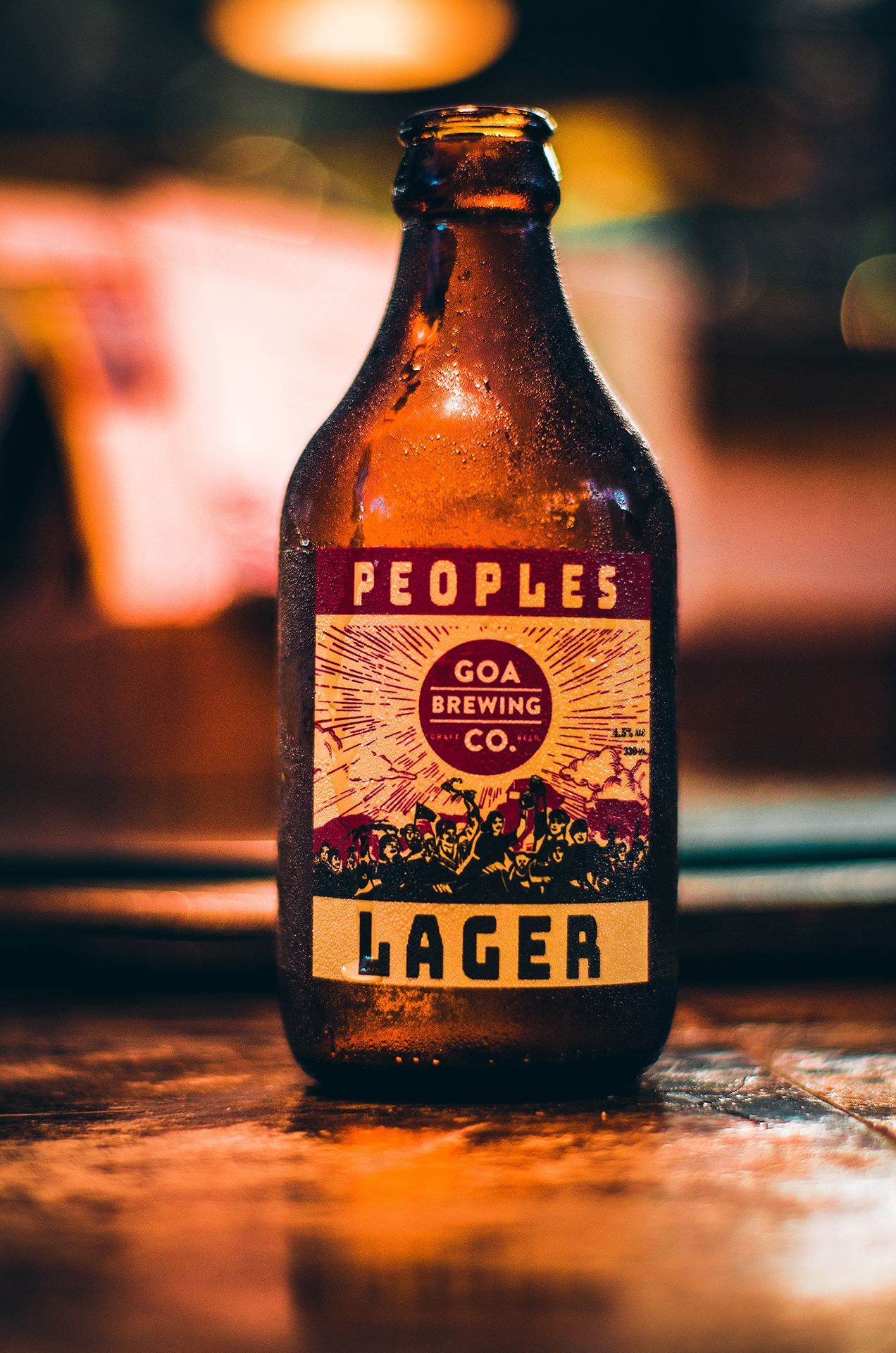 A close up of a bottle of Peoples Lager from Goa brewing company
