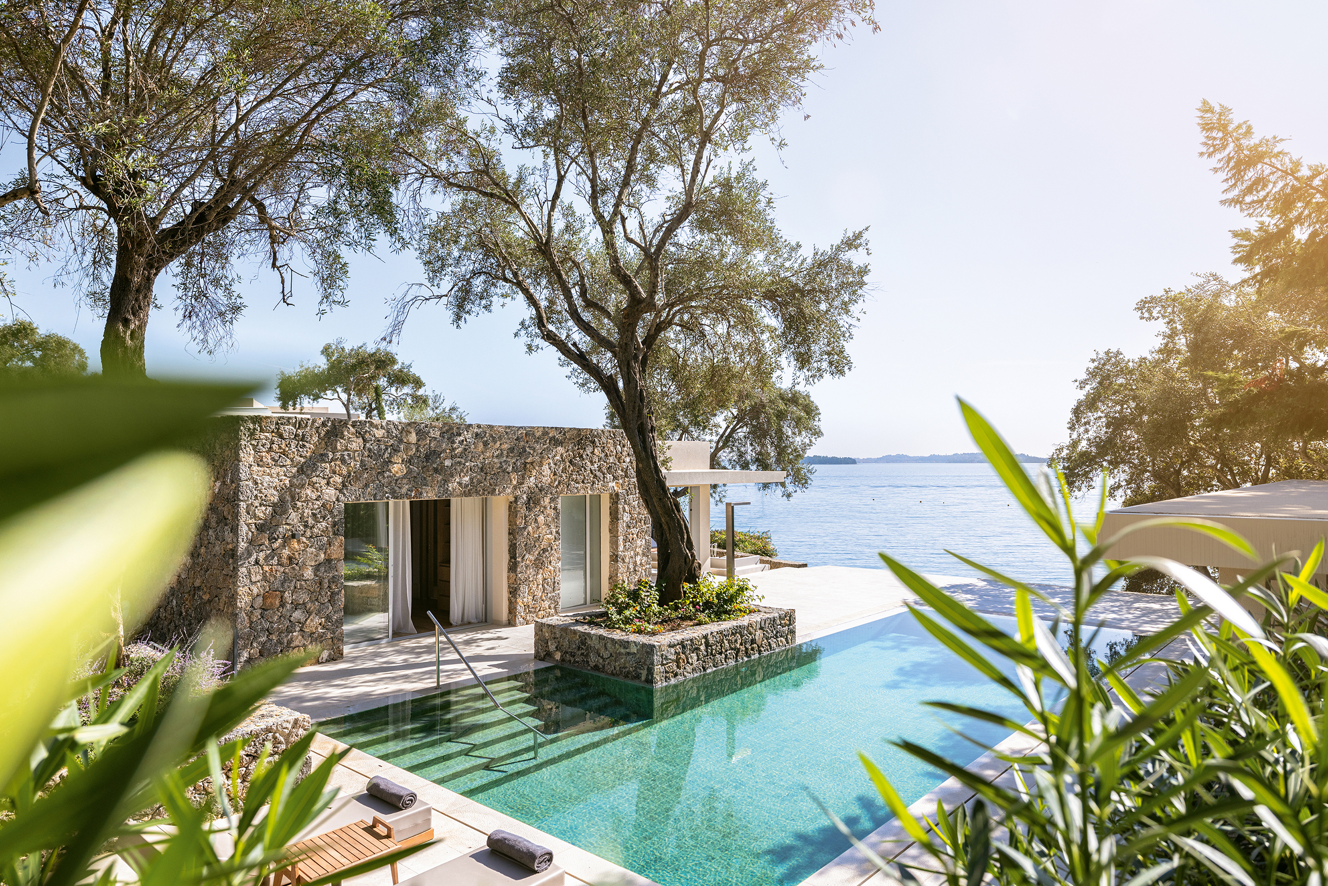 Luxury villa residence at Grecotel Corfu Imperial with private pool, lush gardens, and panoramic Ionian Sea views.