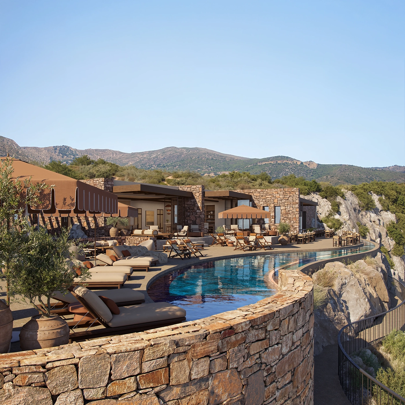 A raised outdoor infinity pool lined by beige sunloungers