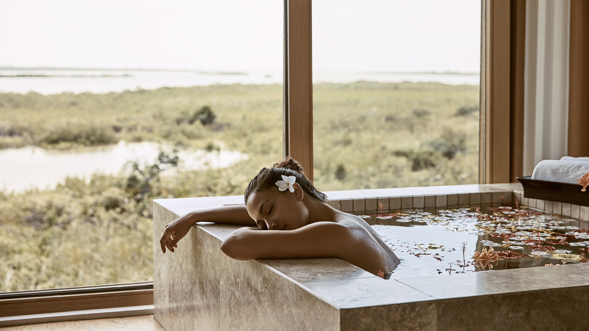 Caribbean & Mexico, COMO Parrot Cay, Turks and Caicos, woman relaxing in a bath