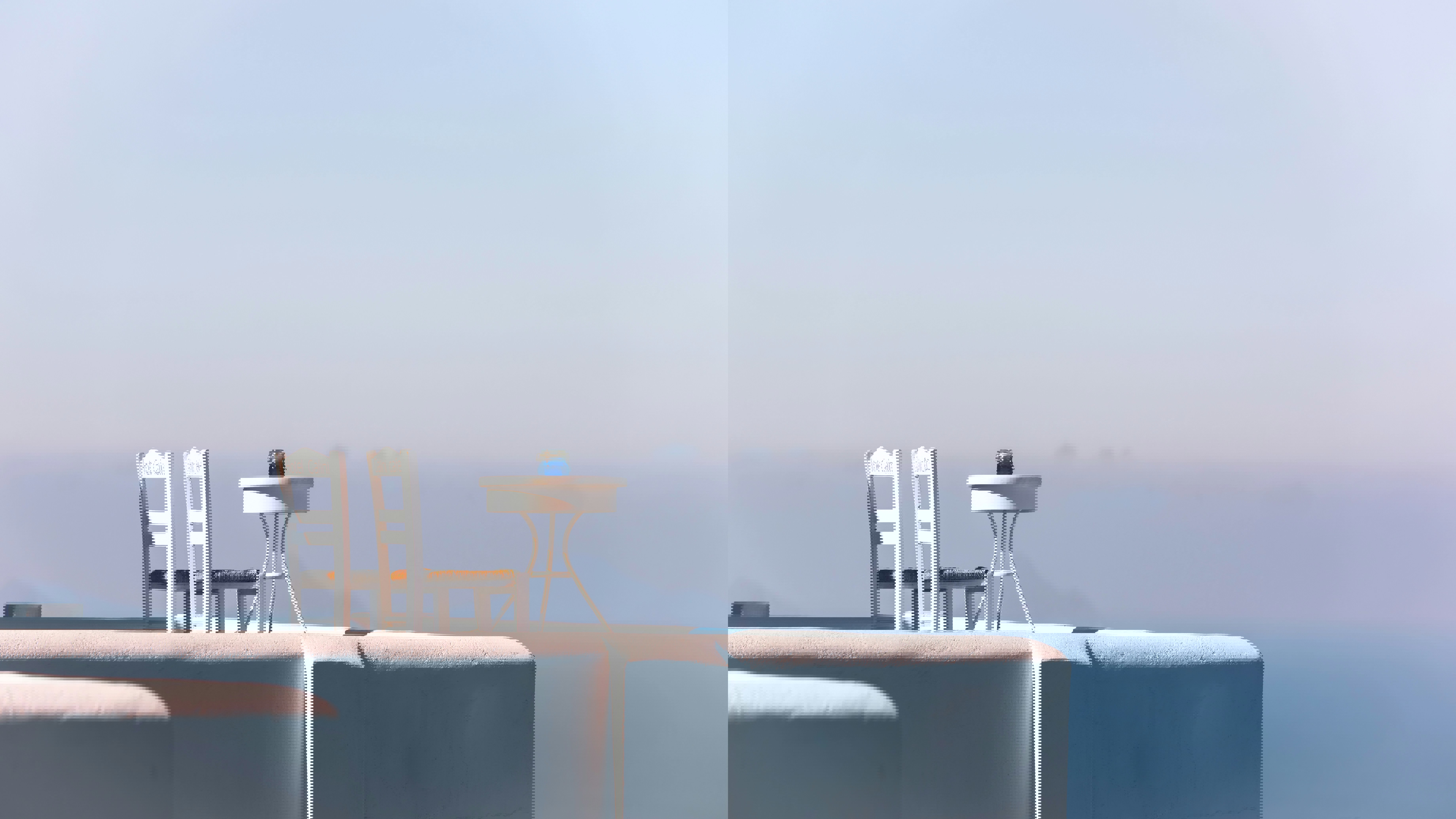 Two seater table and chairs on terrace in Santorini