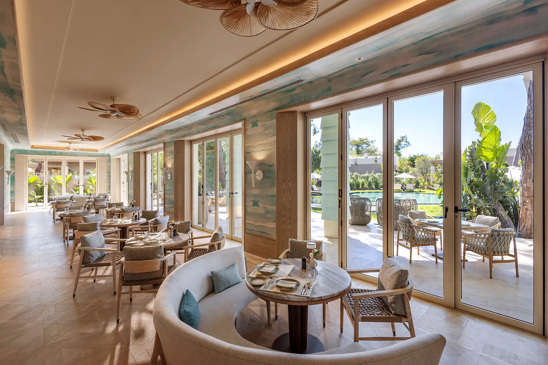 Europe, Turkey, Bijal, dining tables set by floor to ceiling windows in the club house 