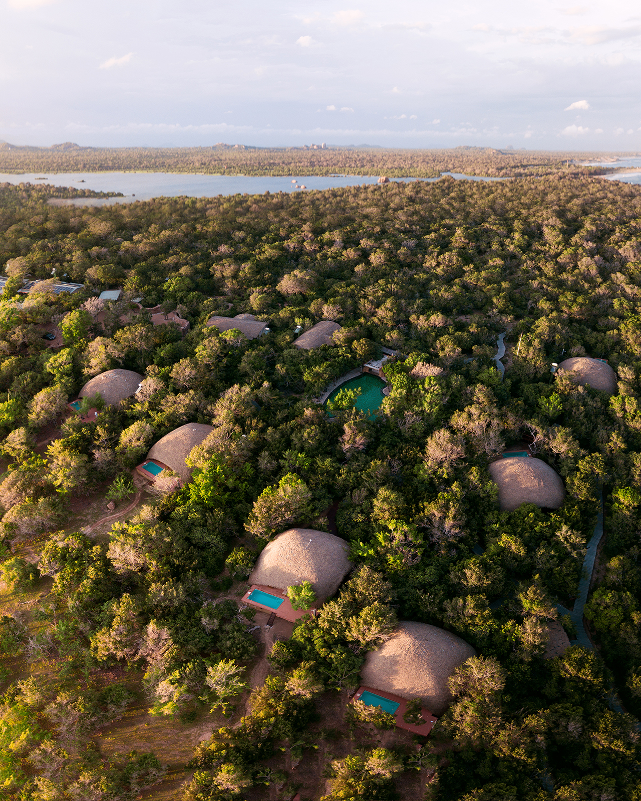 Asia Sri Lanka, Uga Chena Huts, ariel view of individual huts with private pools nestled in a green landscape 