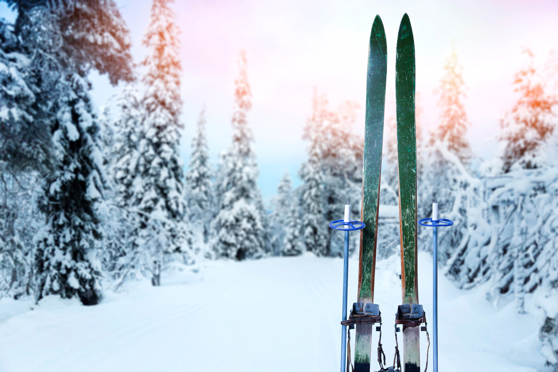 Cross country ski trail with retro wood skis and ski poles