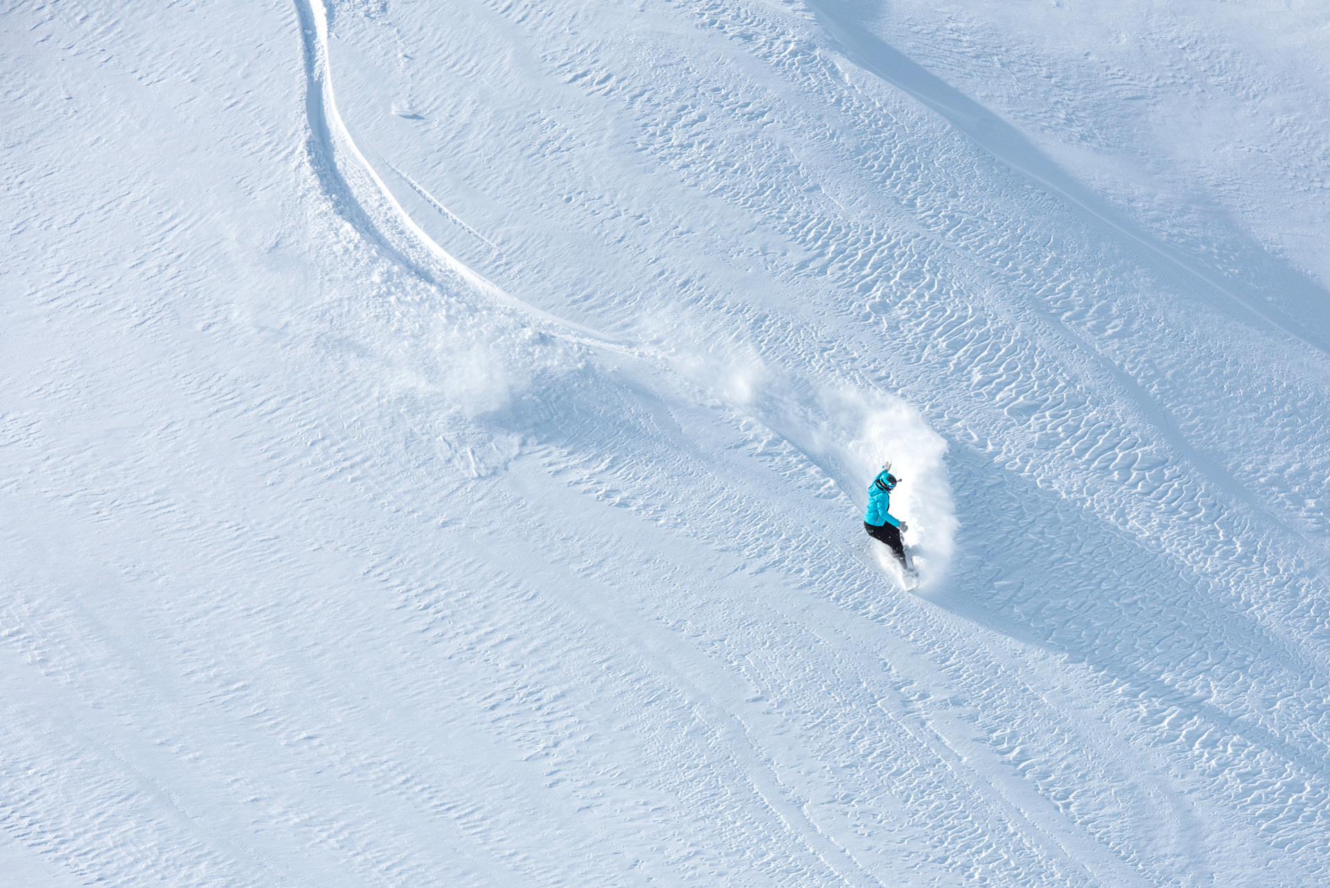 Skier skiing off-piste on a mountain slope