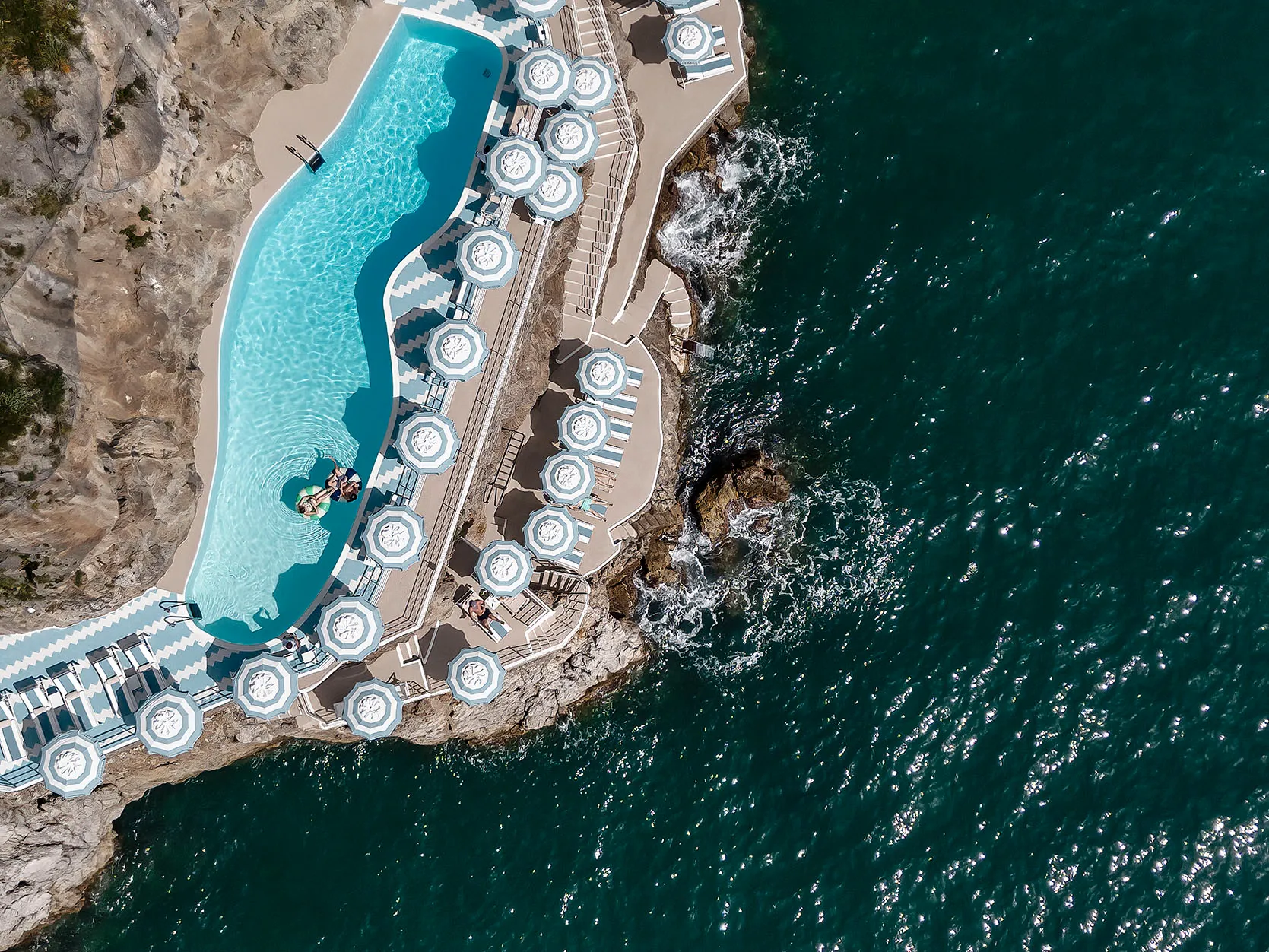 Europe, Italy, Amalfi Coast, Hotel Miramalfi, view of the cliffside pool and beach club from above 