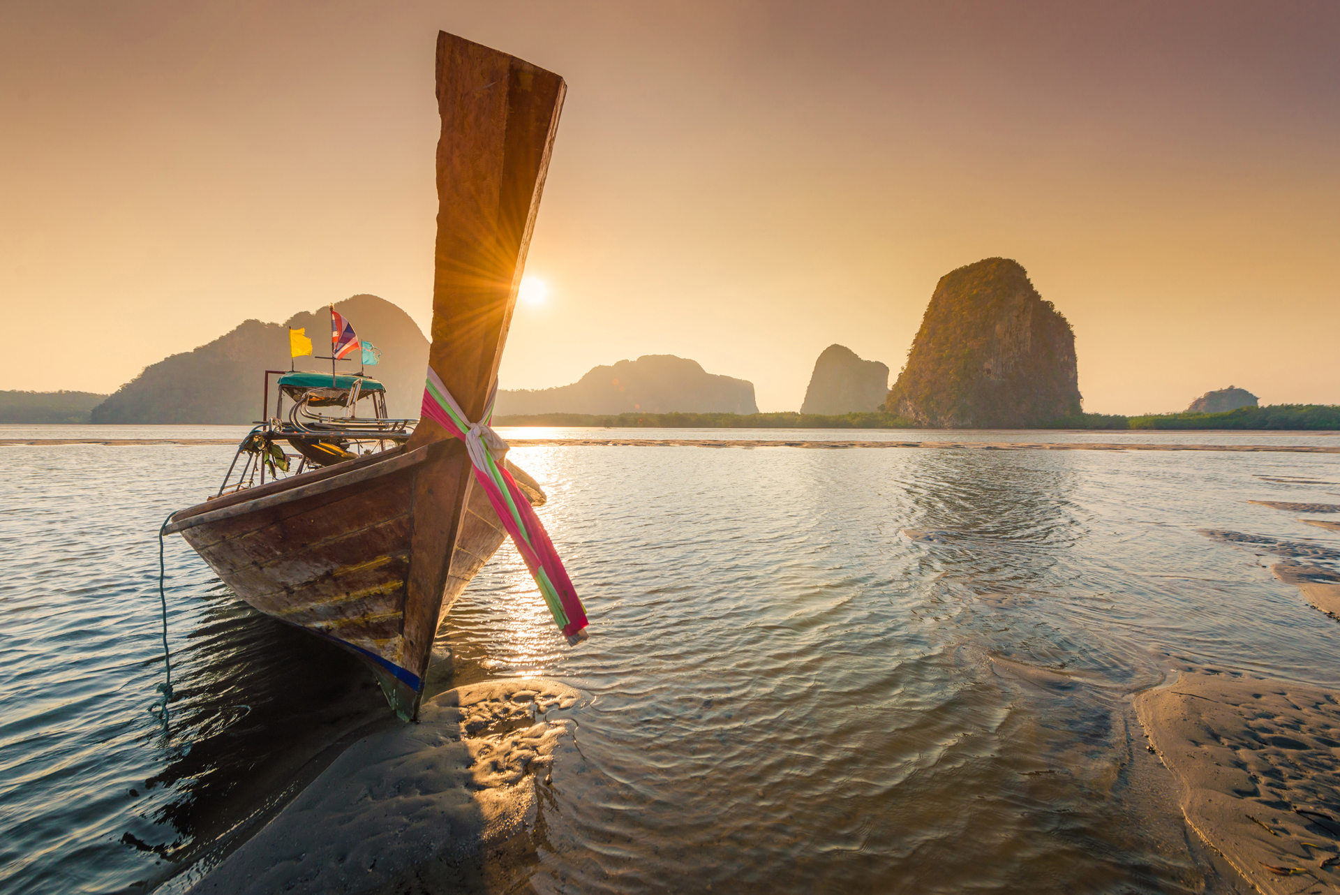 A wooden boat on the water in Phuket, Thailand