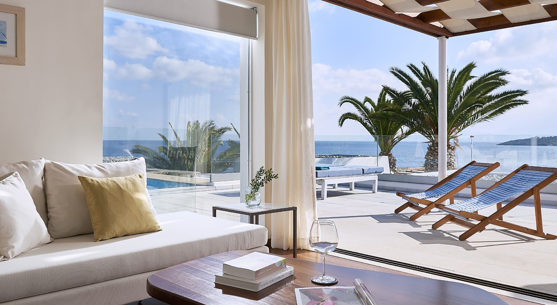 Europe, Greece, Crete, St. Nicolas Bay Resort Hotel & Villas, Villa sitting area looking out to sea
