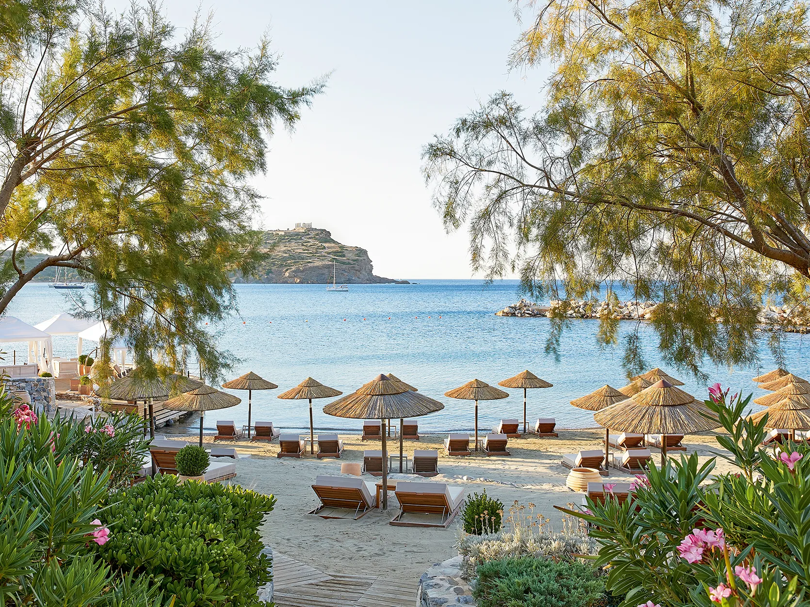 Europe, Greece, Athens Riviera, Cape Sounio, sun loungers and parasols at the beach