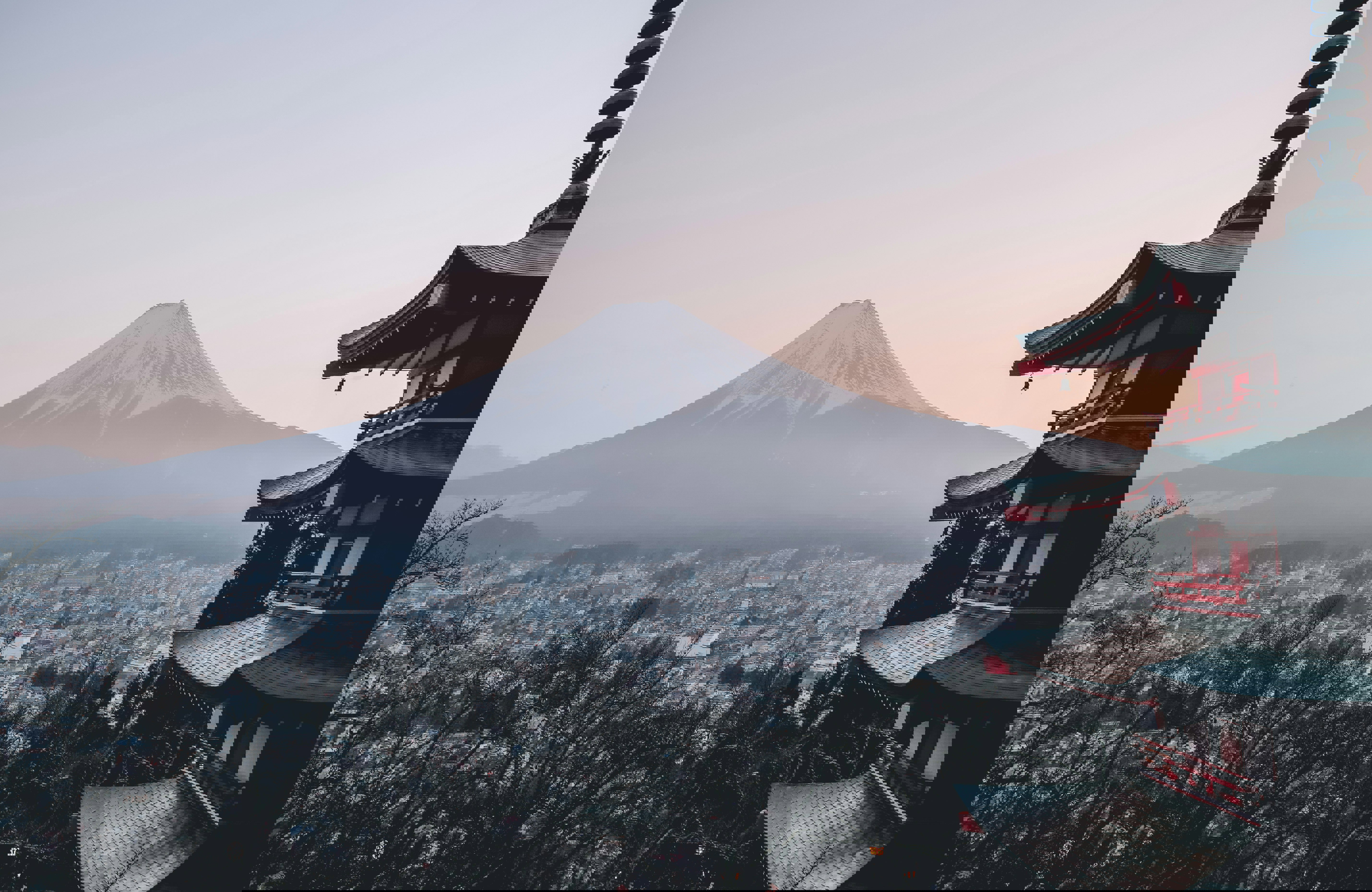 The view from Chureito Pagoda in Fujiyoshida looking down to the city and the snow-capped Mount Fuji beyond