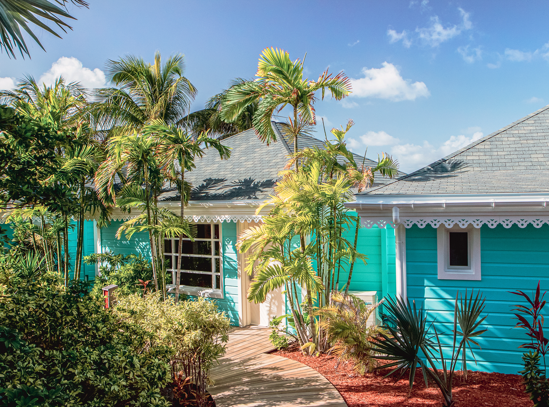 Blue small accommodation suites surrounded by plants
