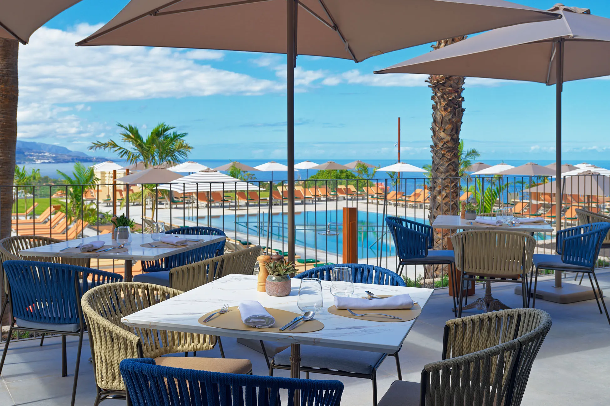 Scenic terrace at Gran Hotel Taoro in Tenerife with outdoor dining and panoramic ocean and city views.