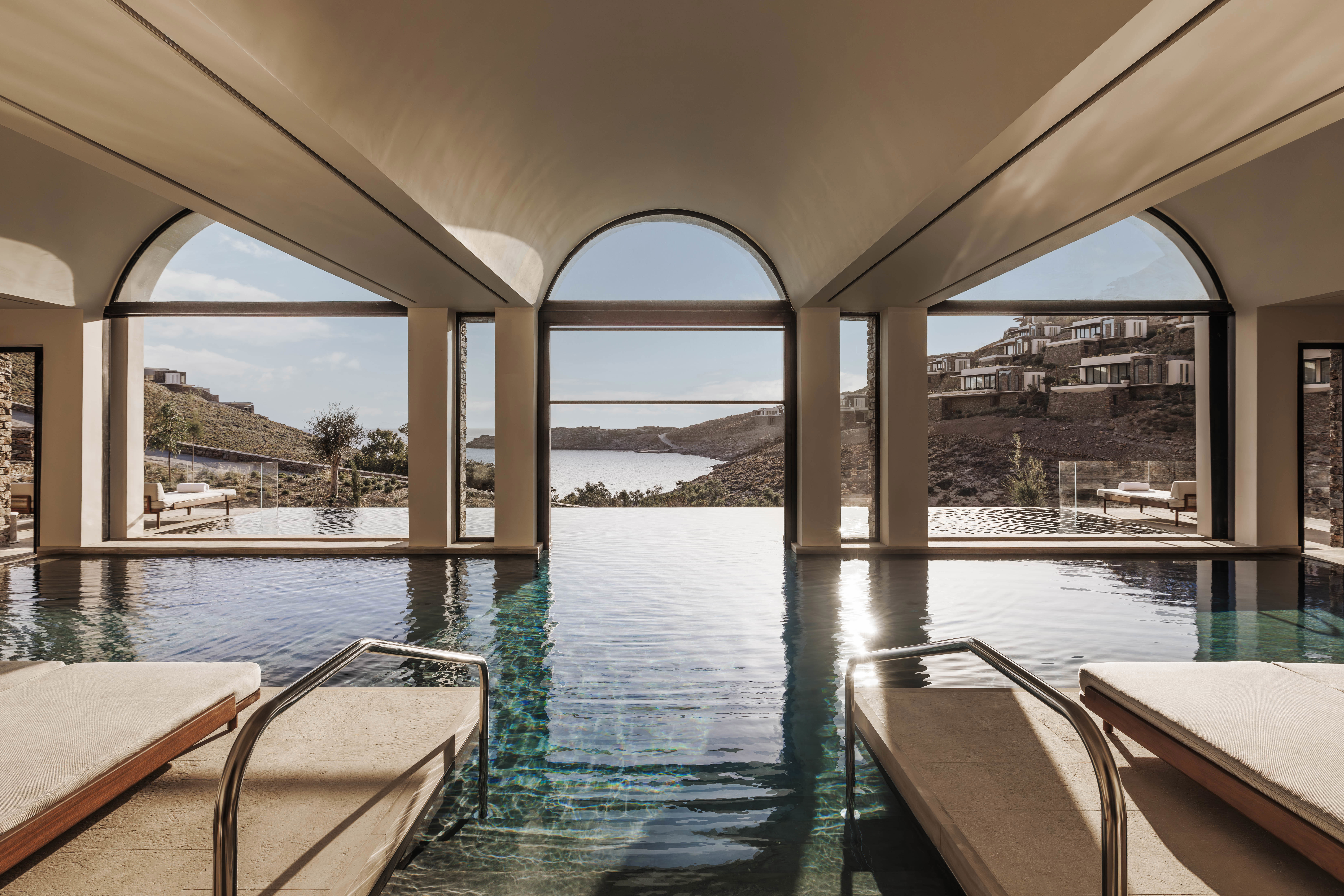 Indoor spa pool with arched ceiling and views of the ocean