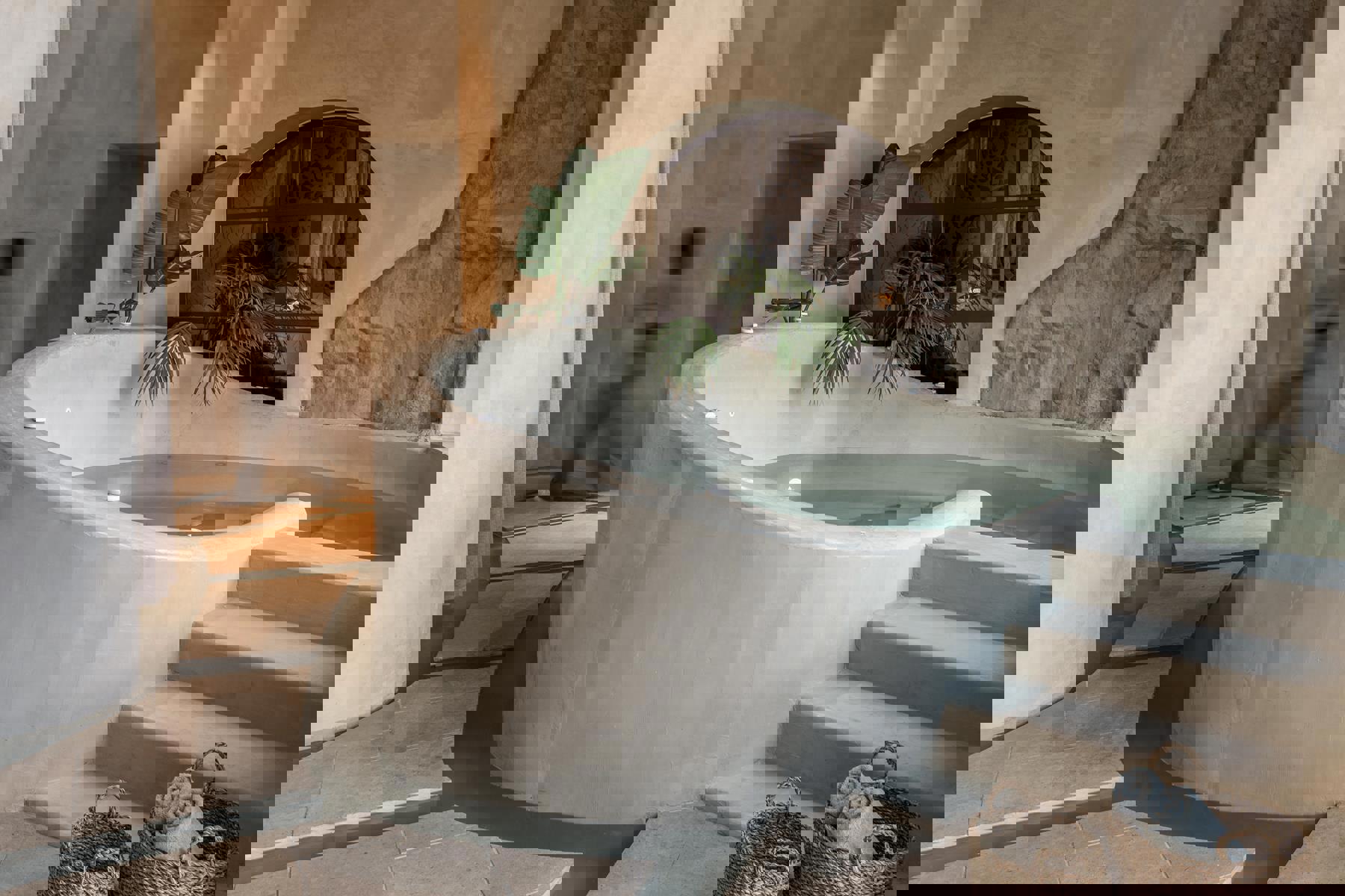 Stone plunge pool in the spa at Acro Wellness Suites