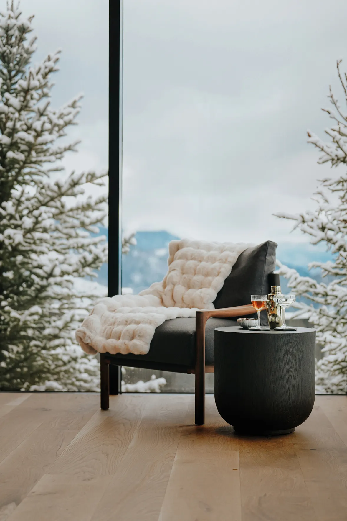 A chair with side table with a cocktail at One&Only Moonlight Basin