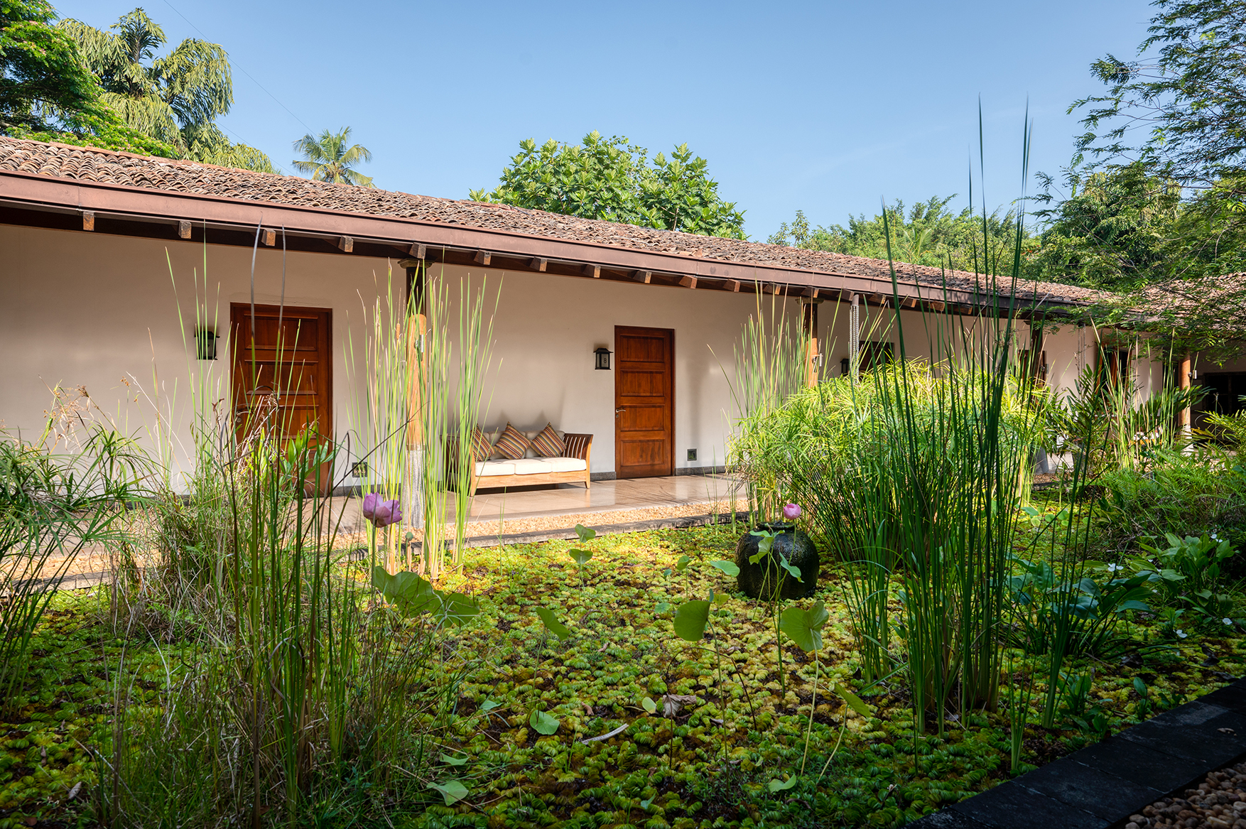 Asia, Sri Lanka, Ulagalla Resort, view of villa door from outside with green courtyard