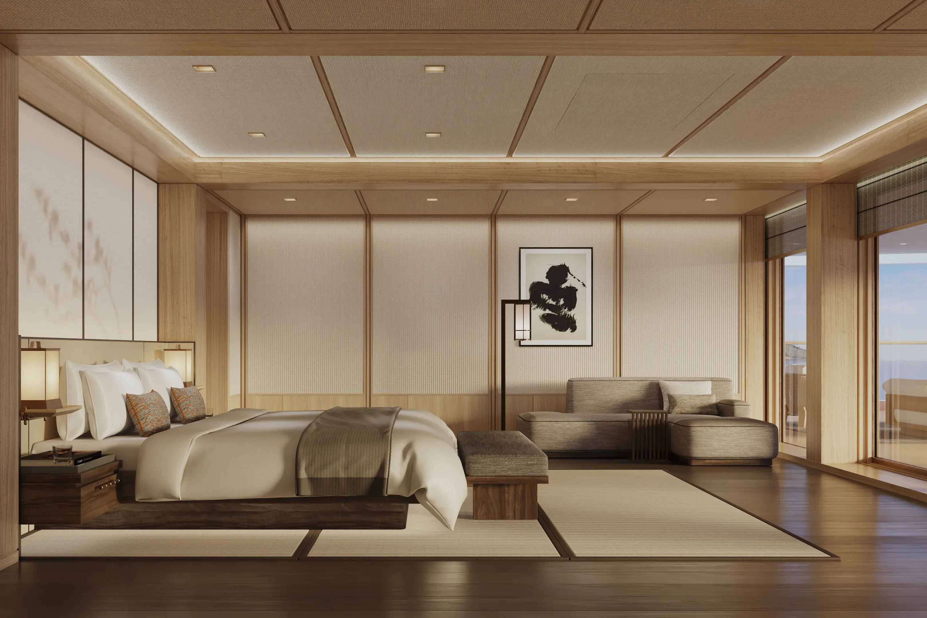 The bedroom of the Aman Suite aboard Amangati featuring traditional Japanese room style decor with a plush bed, sofa and simple wall art all in neutral tones
