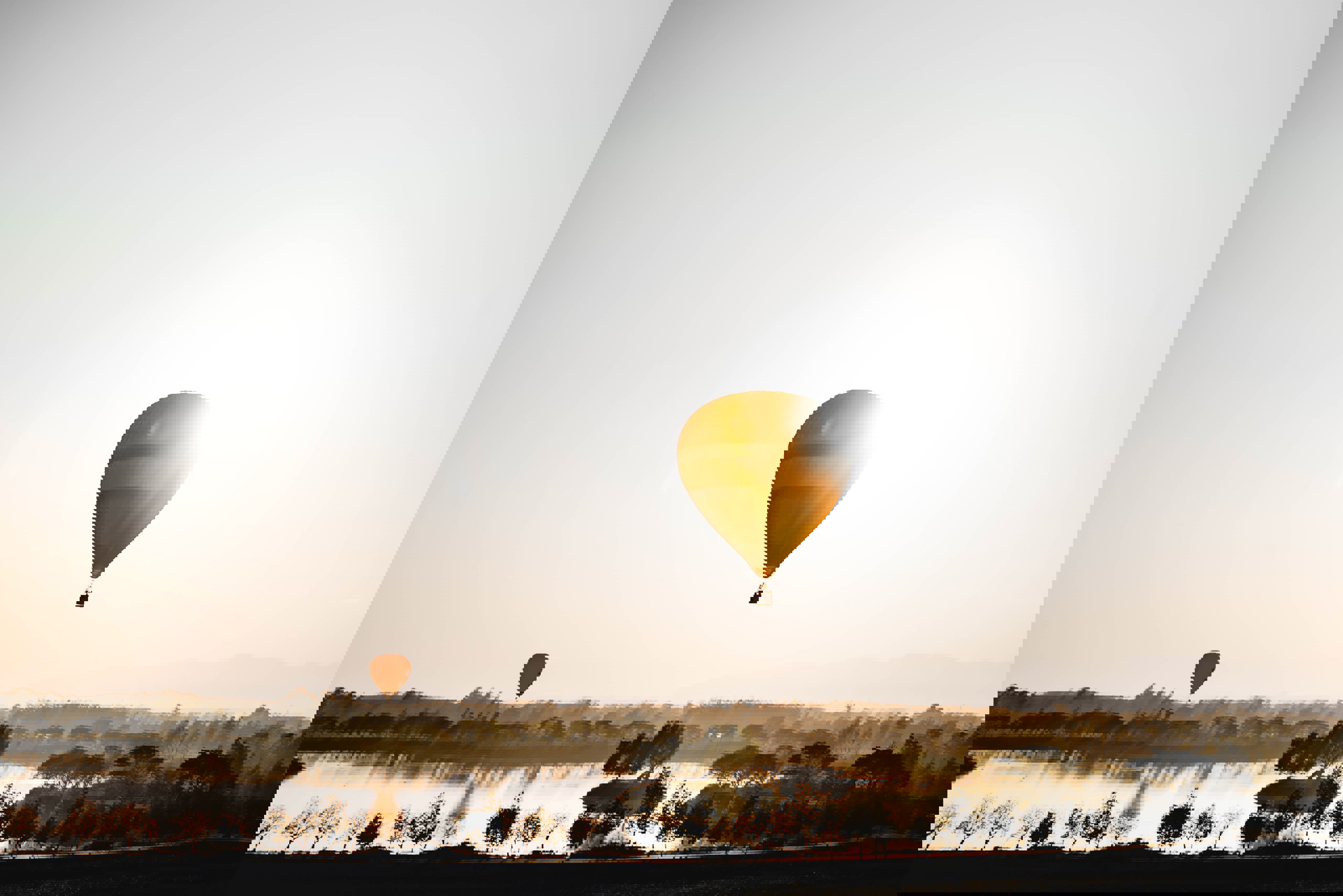 Hot air balloon over a lake in Chiang Rai