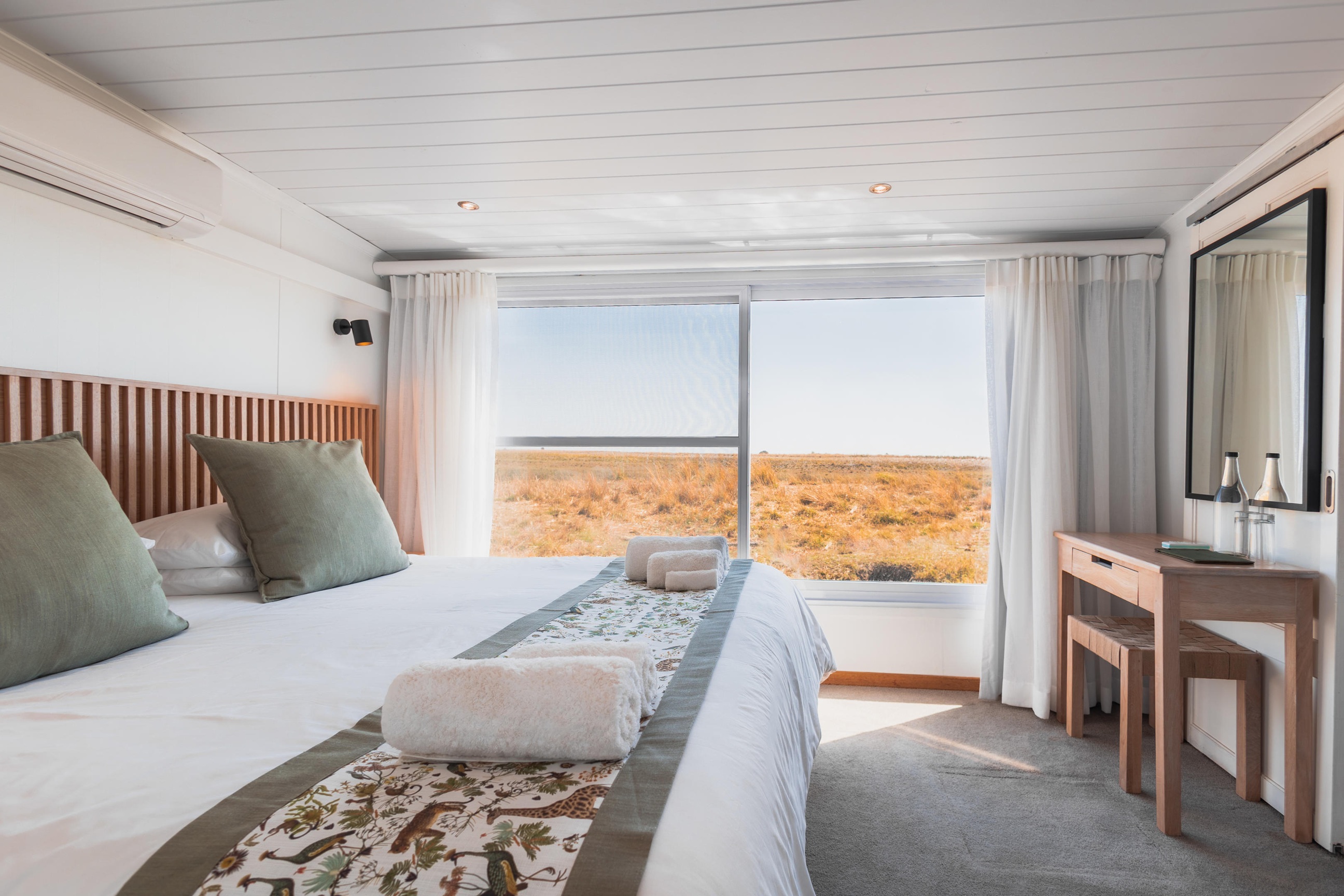 King cabin with panoramic river views aboard the Chobe Princess