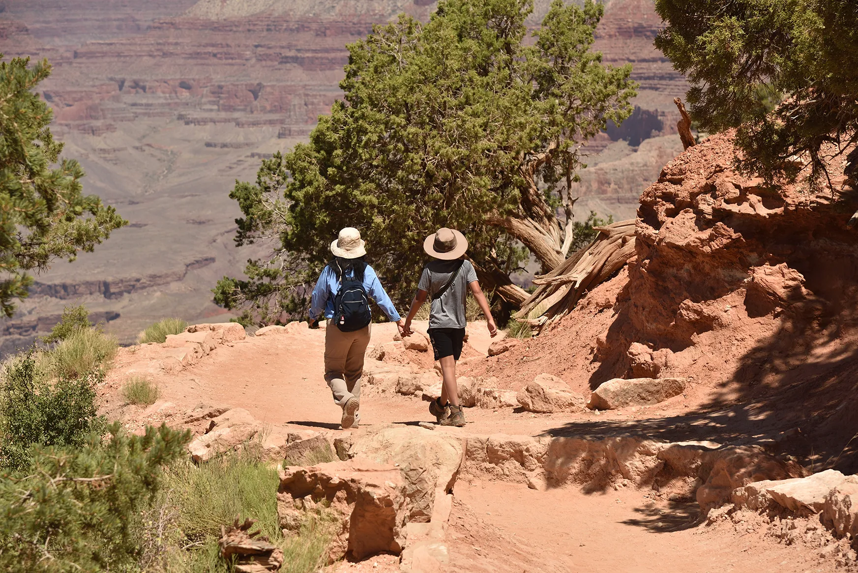 A mother and son walking together at the Grand Canyon 
