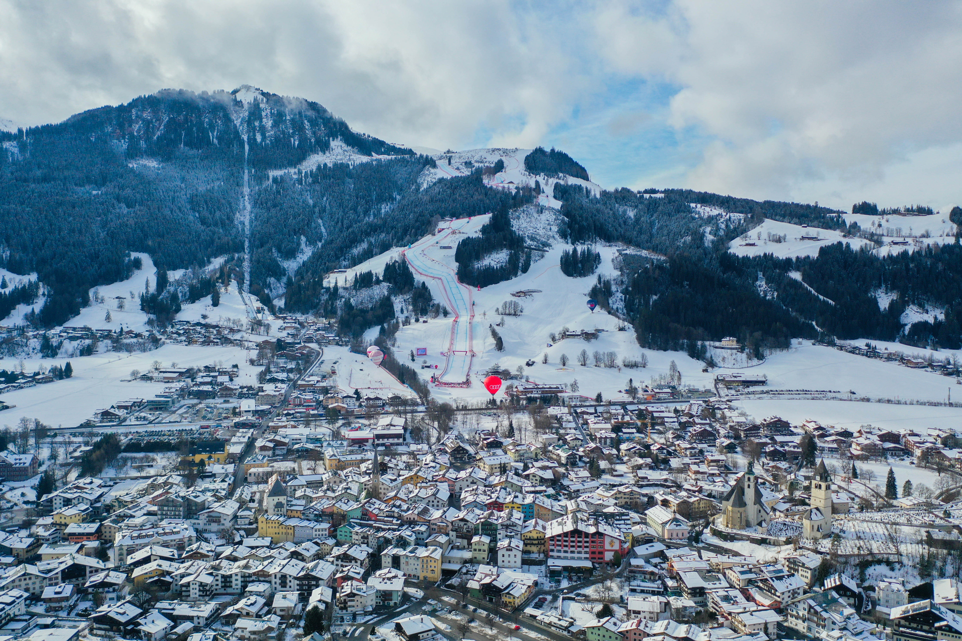 An aerial view of Kitzbühel and the mountain slopes in the background