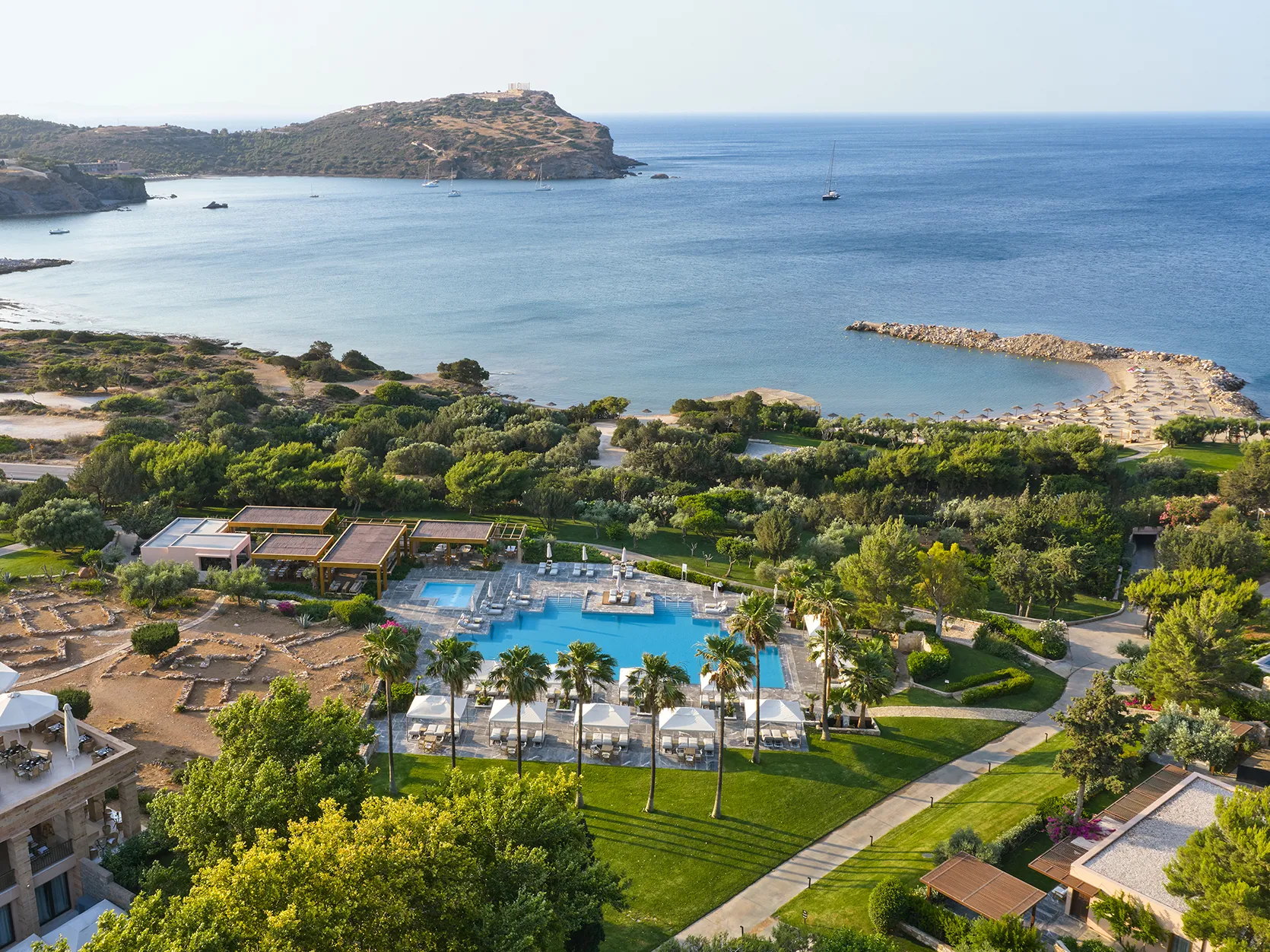 Europe, Greece, Athens Riviera, Cape Sounio, aerial view of the resort with the sea and the temple of poseidon in the background