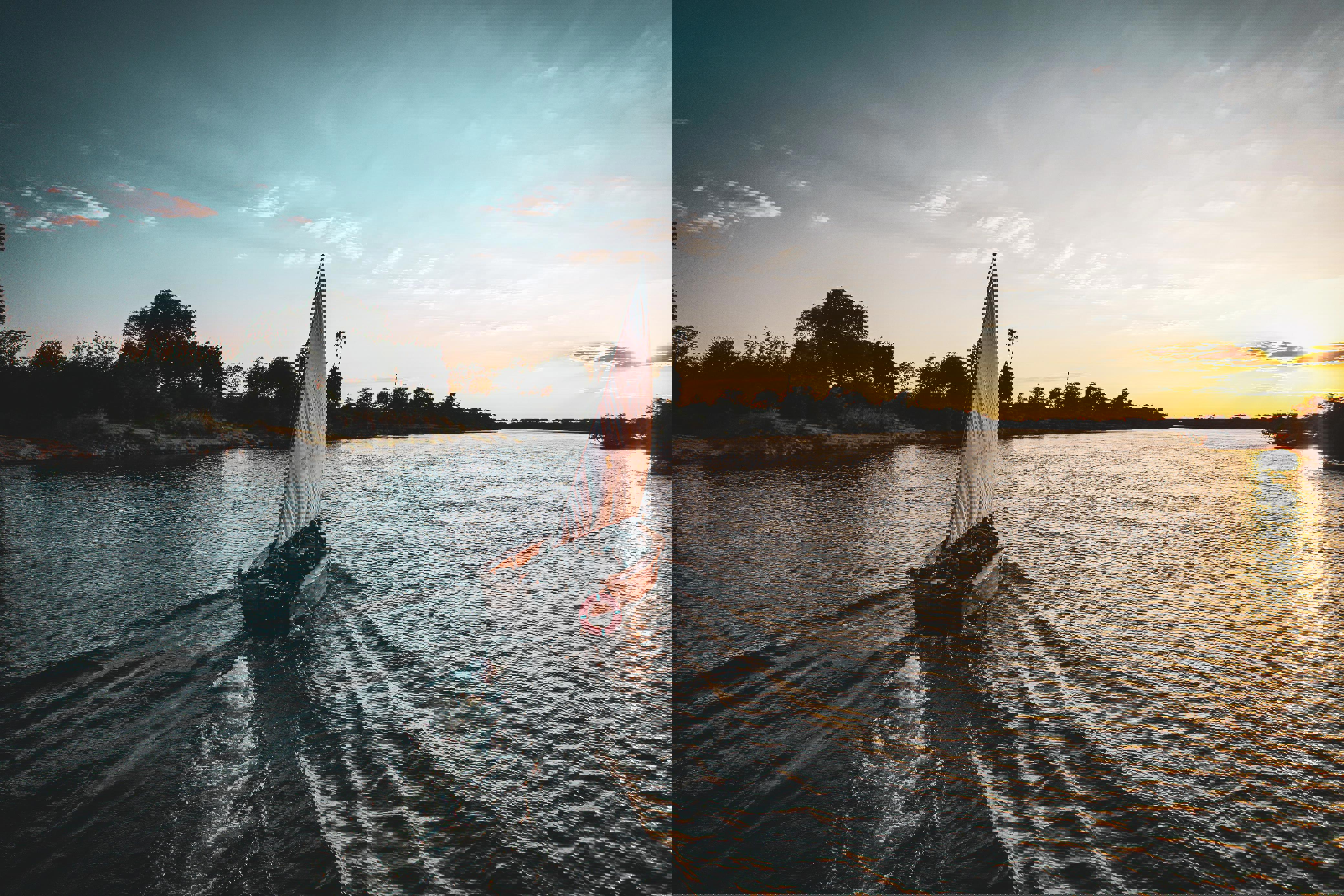 A dhow boat drifting along the Zambezi river towards the sunset on the horizon