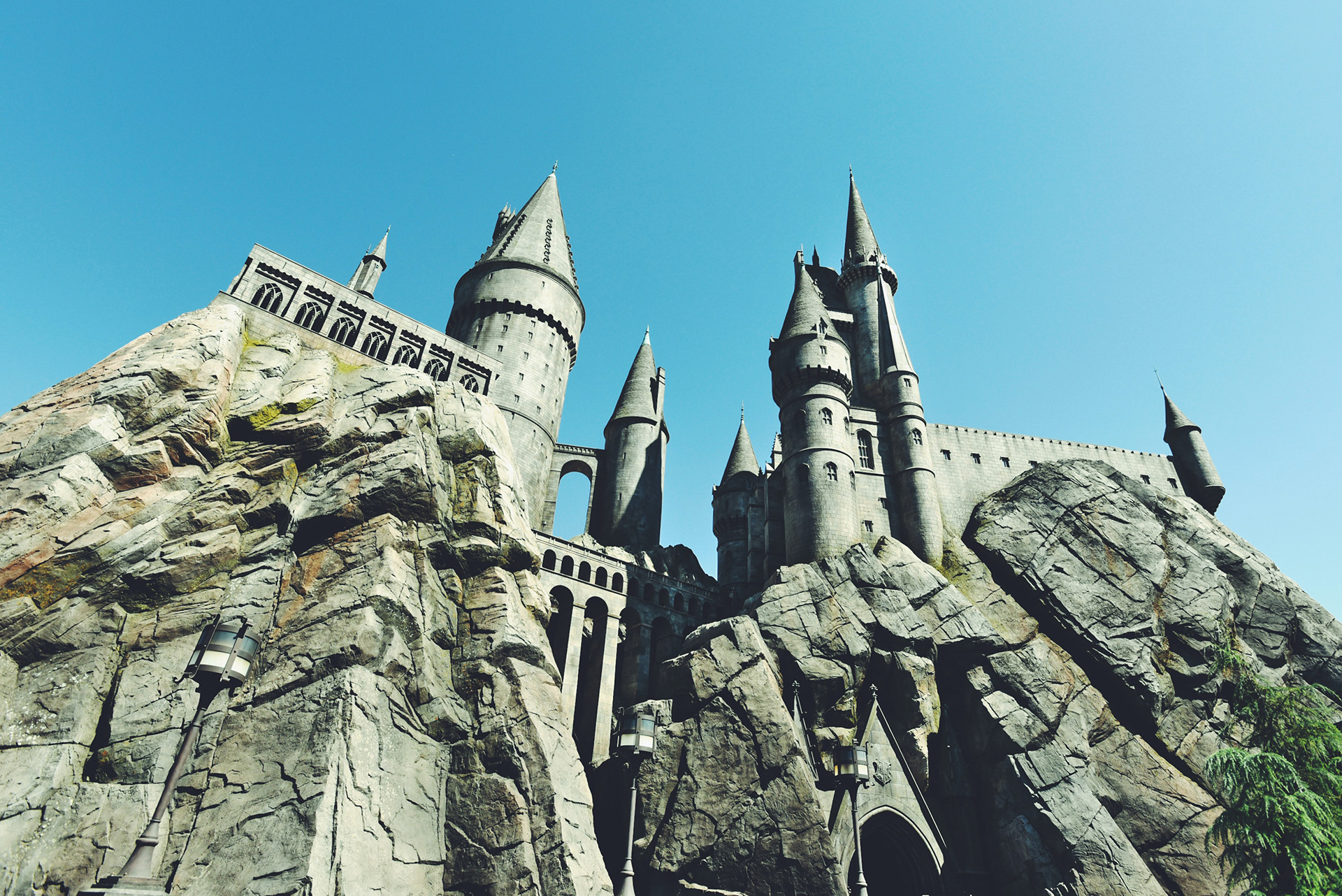 Gray concrete castle at Universal Studios under a blue sky