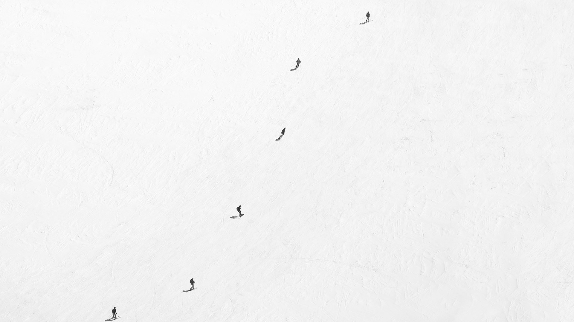 Luxury Ski & Snow, Line of skiers aerial shot