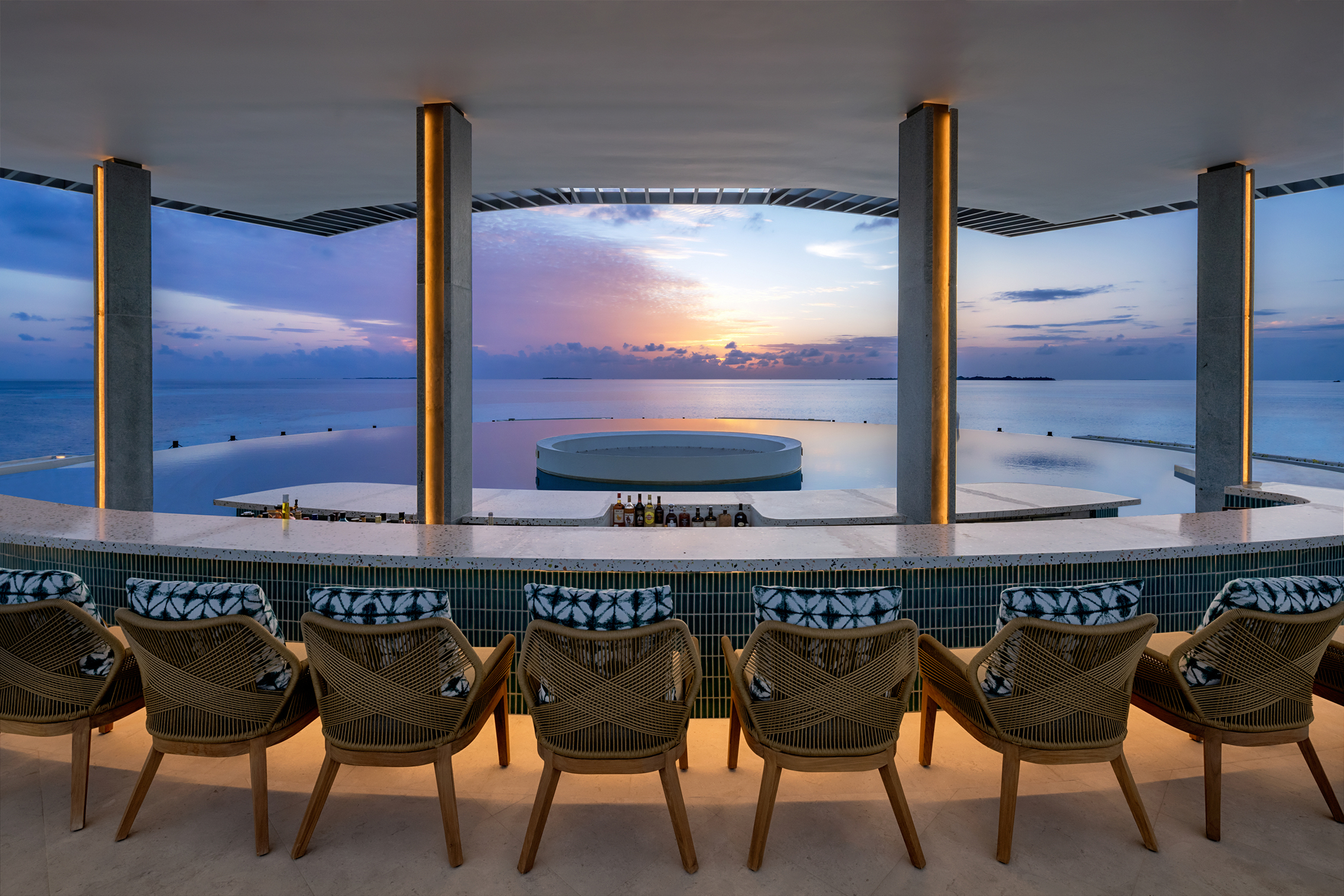 The interior of The Point bar looking out to sea at sunset at Six Senses Kanuhura