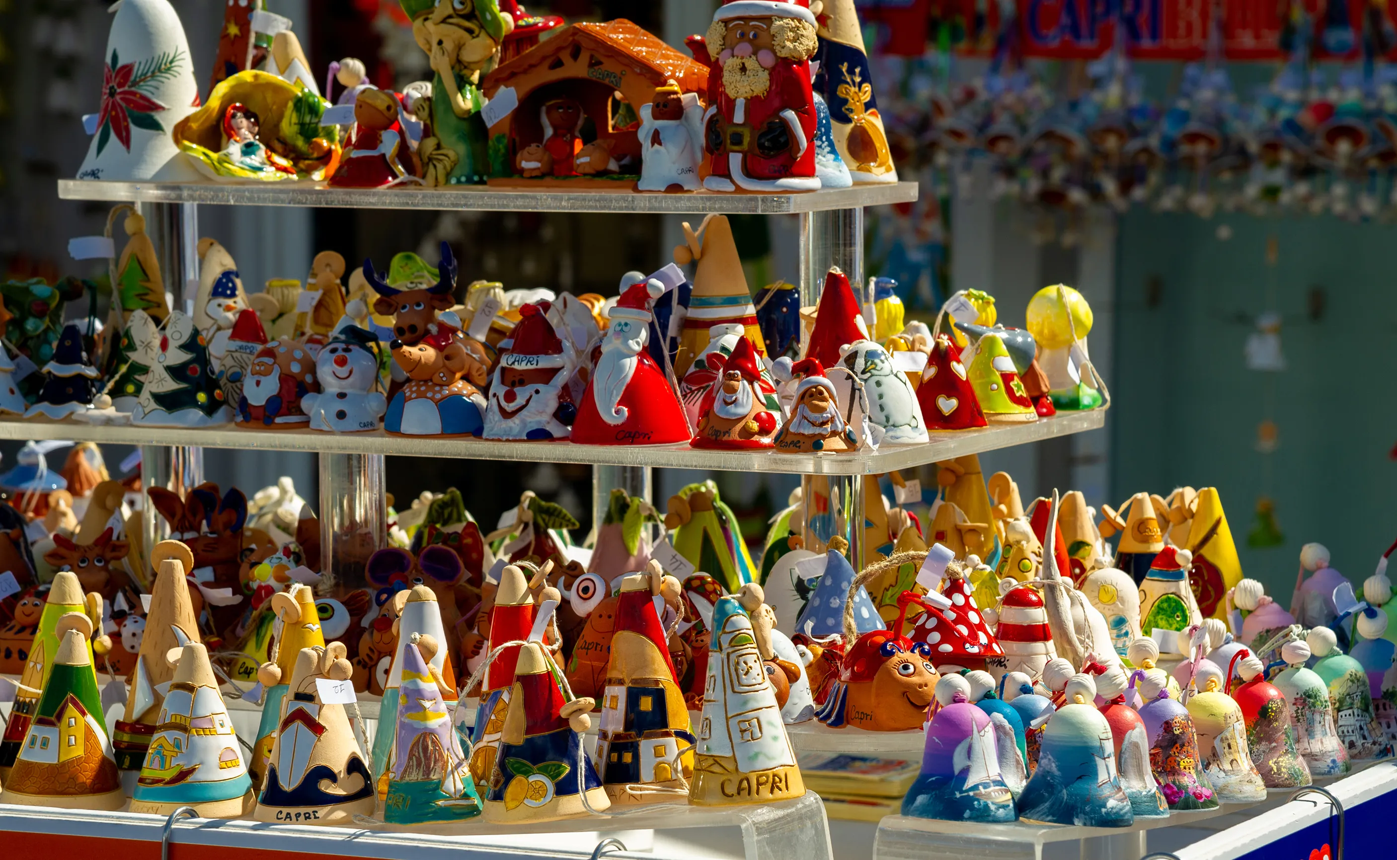 A three-tier stand holding hand-crafted souveniers in Capri.
