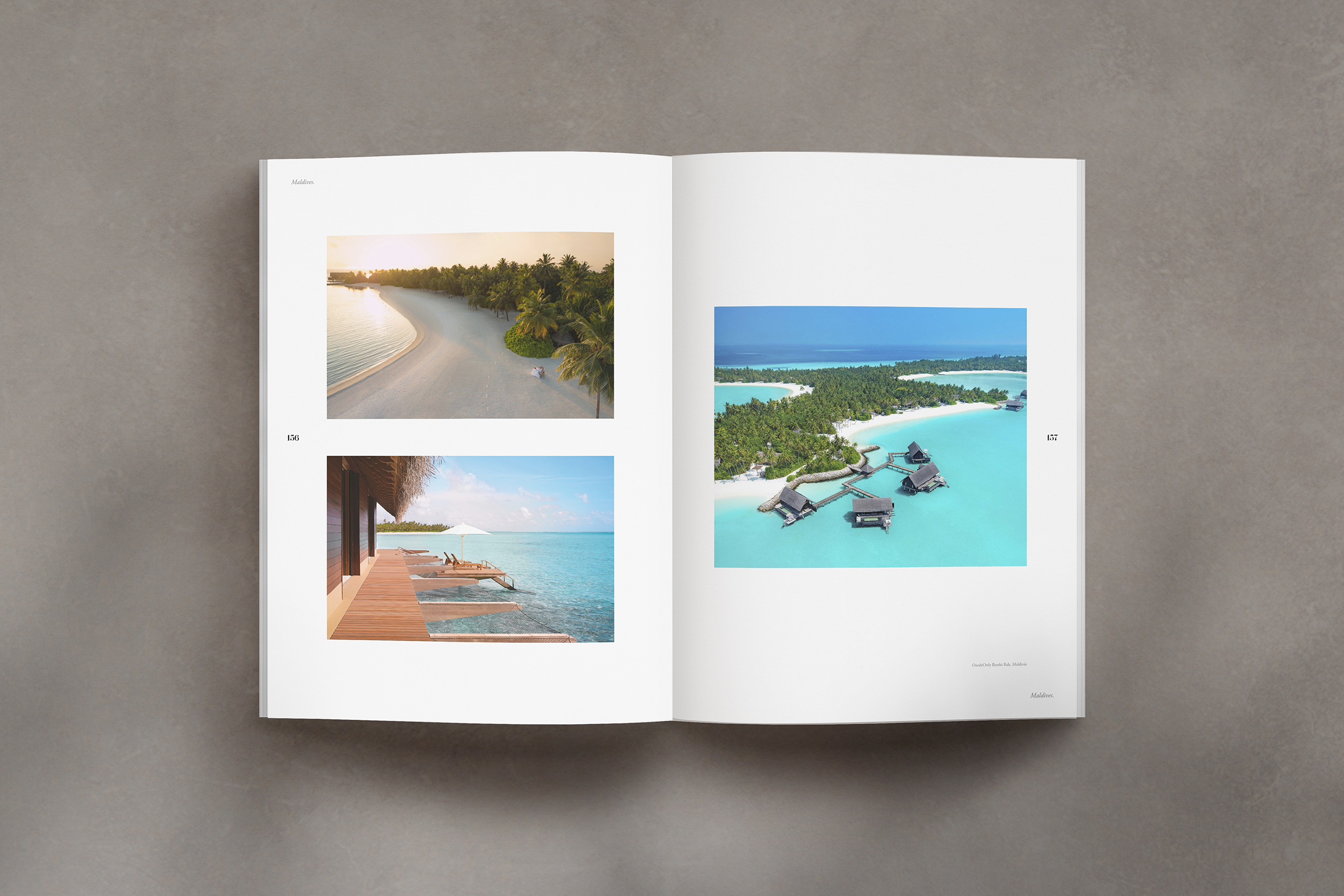 A book lays open on a table, its pages displaying three pictures of picturesque beach destinations