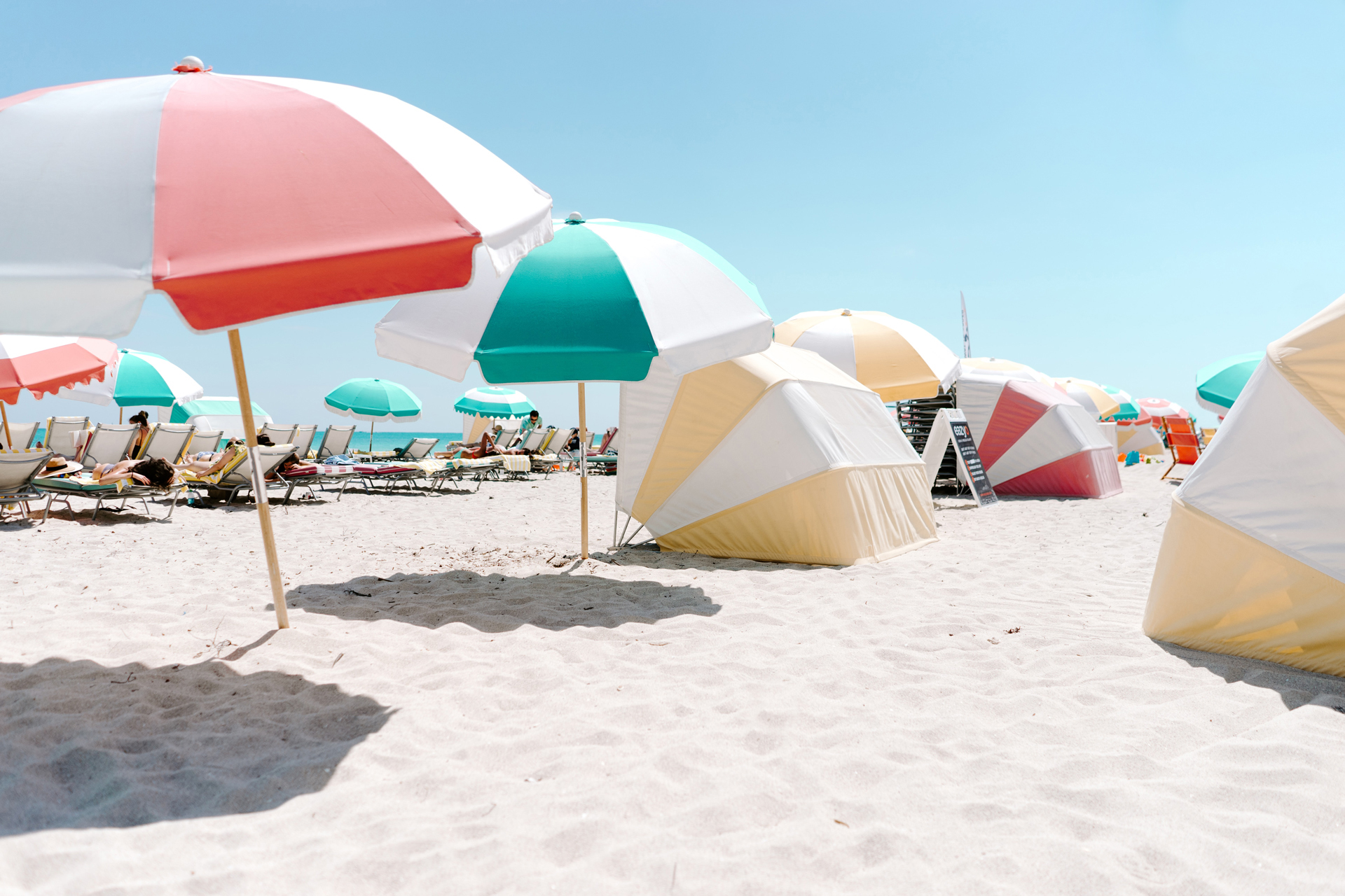 Beach umbrellas and sun loungers on a sandy beach