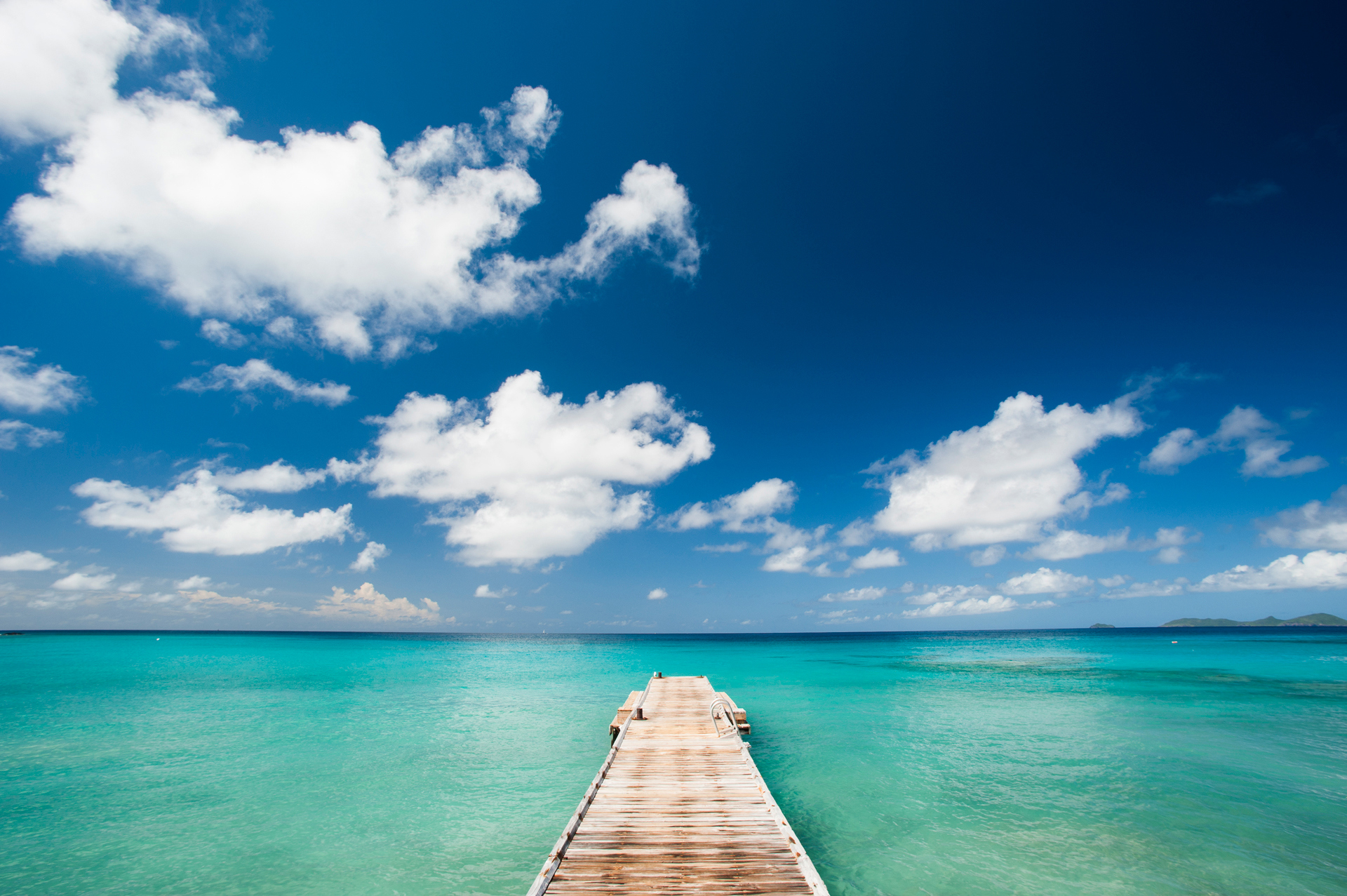 A wooden pier stretching out to sea