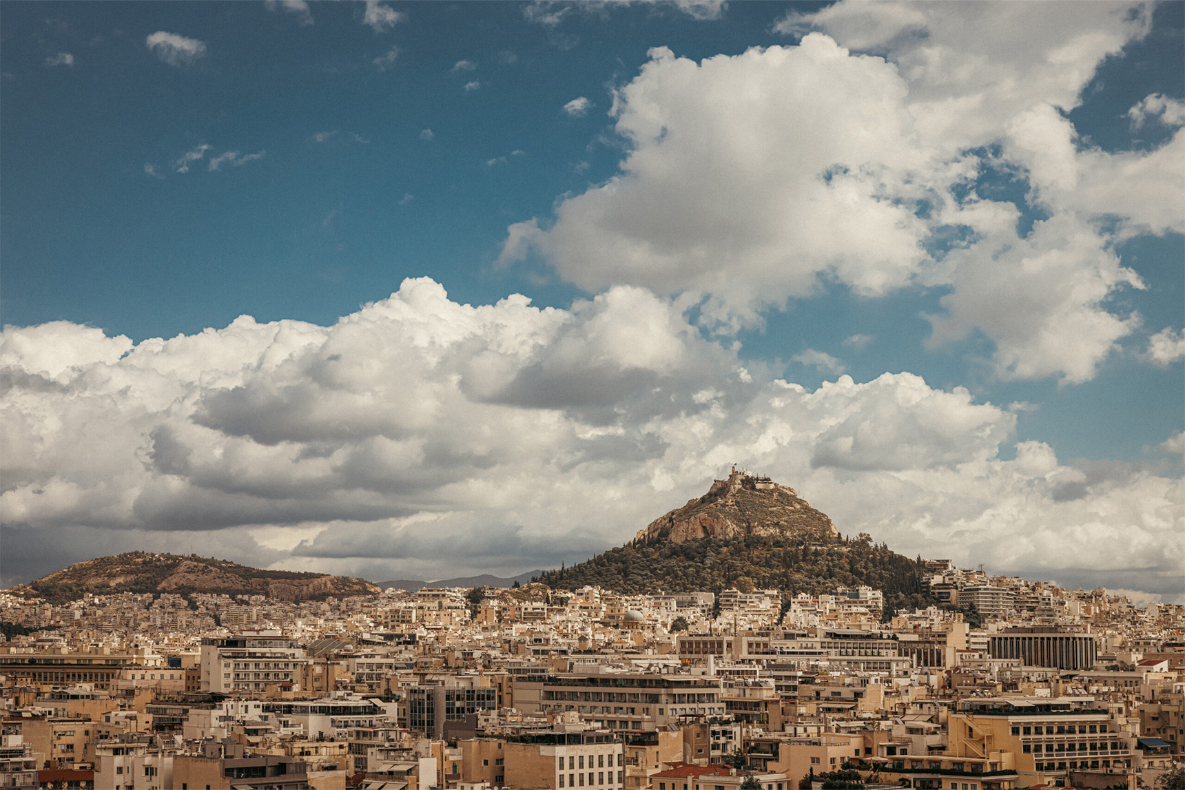 A view across Glyfada, Greece with it's large hill and many buildings