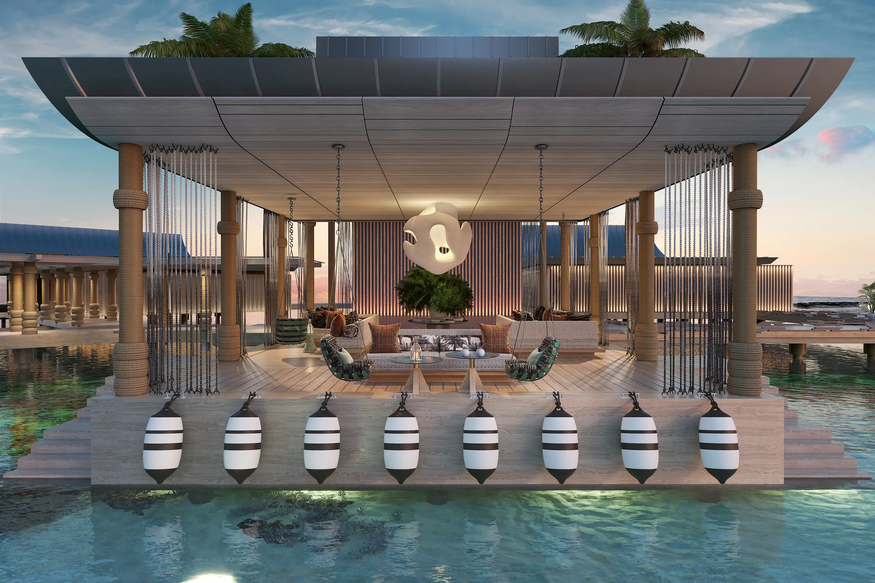 Arrival jetty lounge at .Here Resort in the Maldives featuring modern design over turquoise waters.