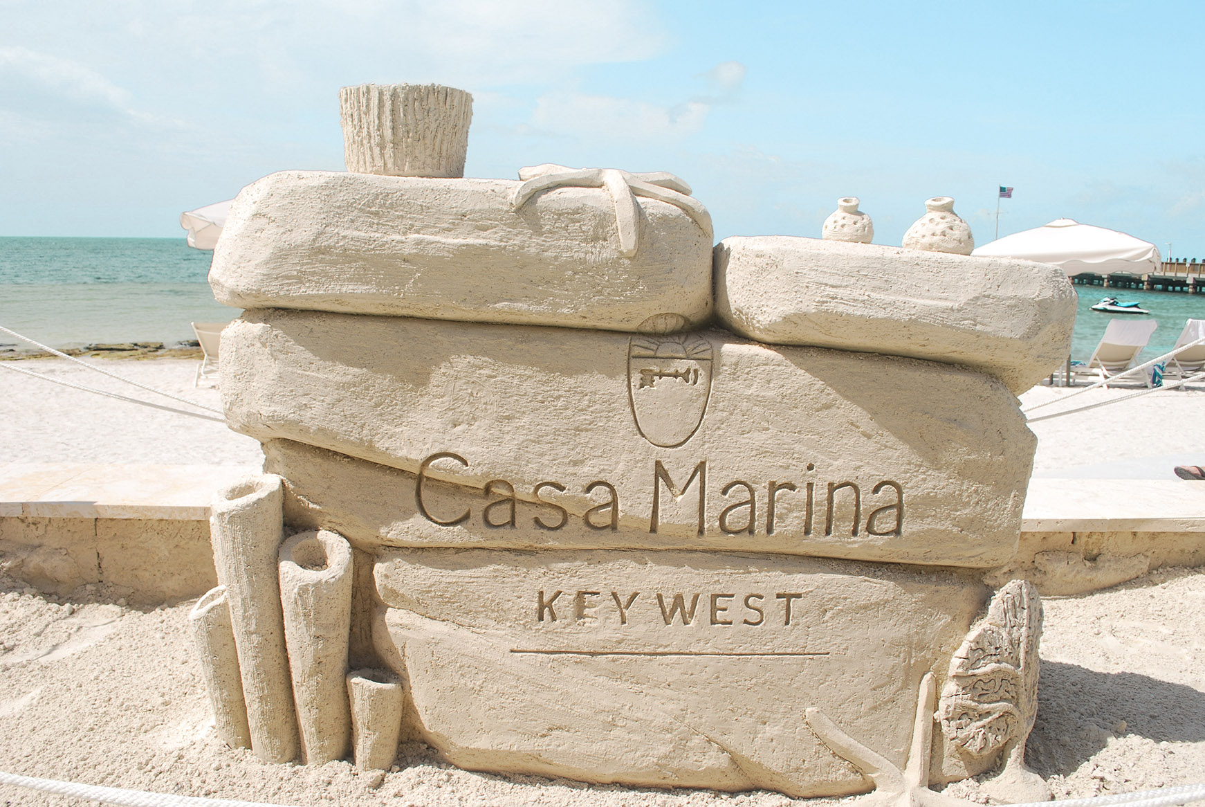 A sand sculpture of stones, coral and starfish on the beach at Casa Marina Key West, Florida 