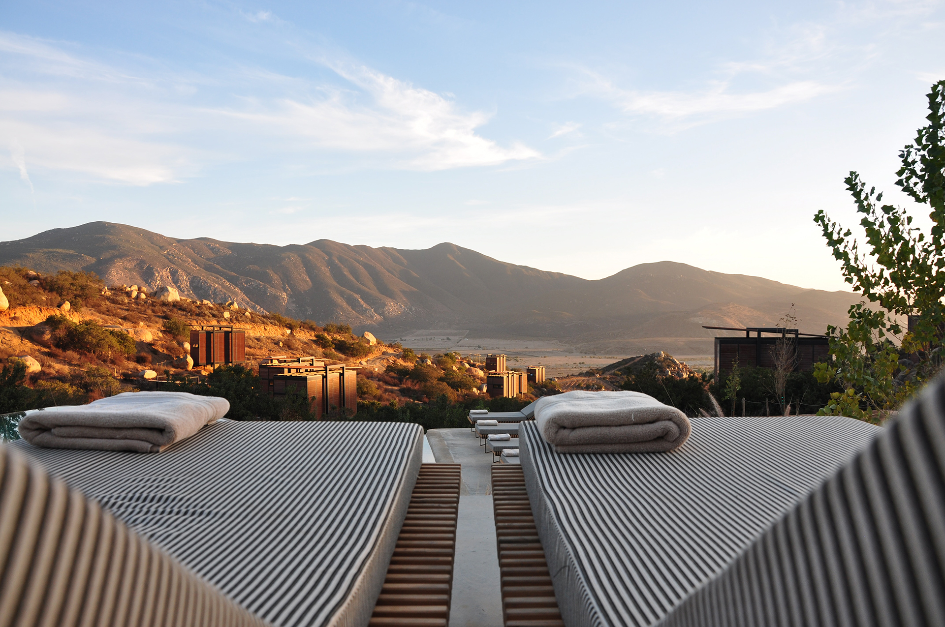 Two sun loungers with views over distant mountains