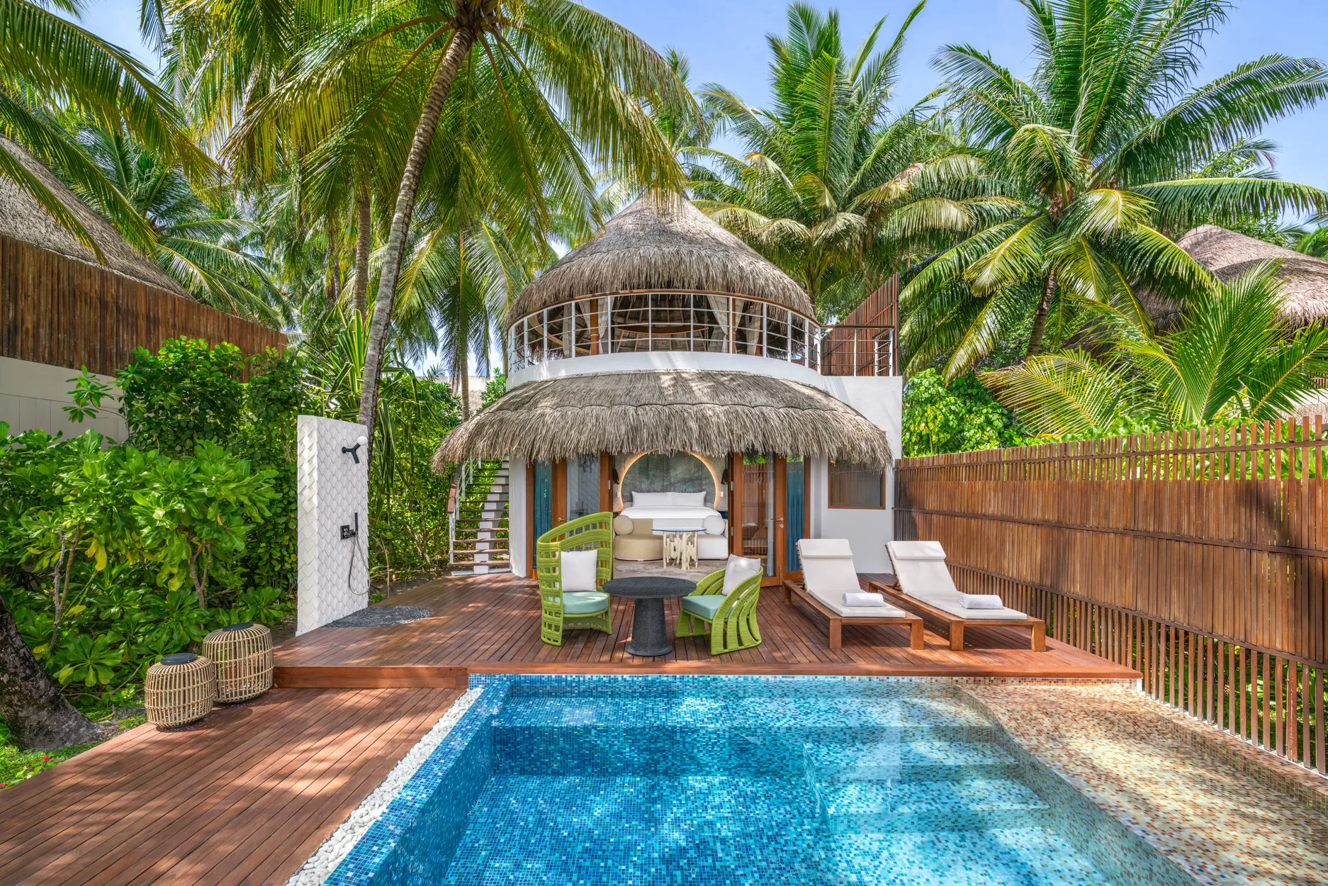 Escape Beach One-Bedroom Villa at W Maldives featuring a private plunge pool, spacious sun deck, thatched-roof architecture, and lush tropical surroundings for an exclusive island retreat