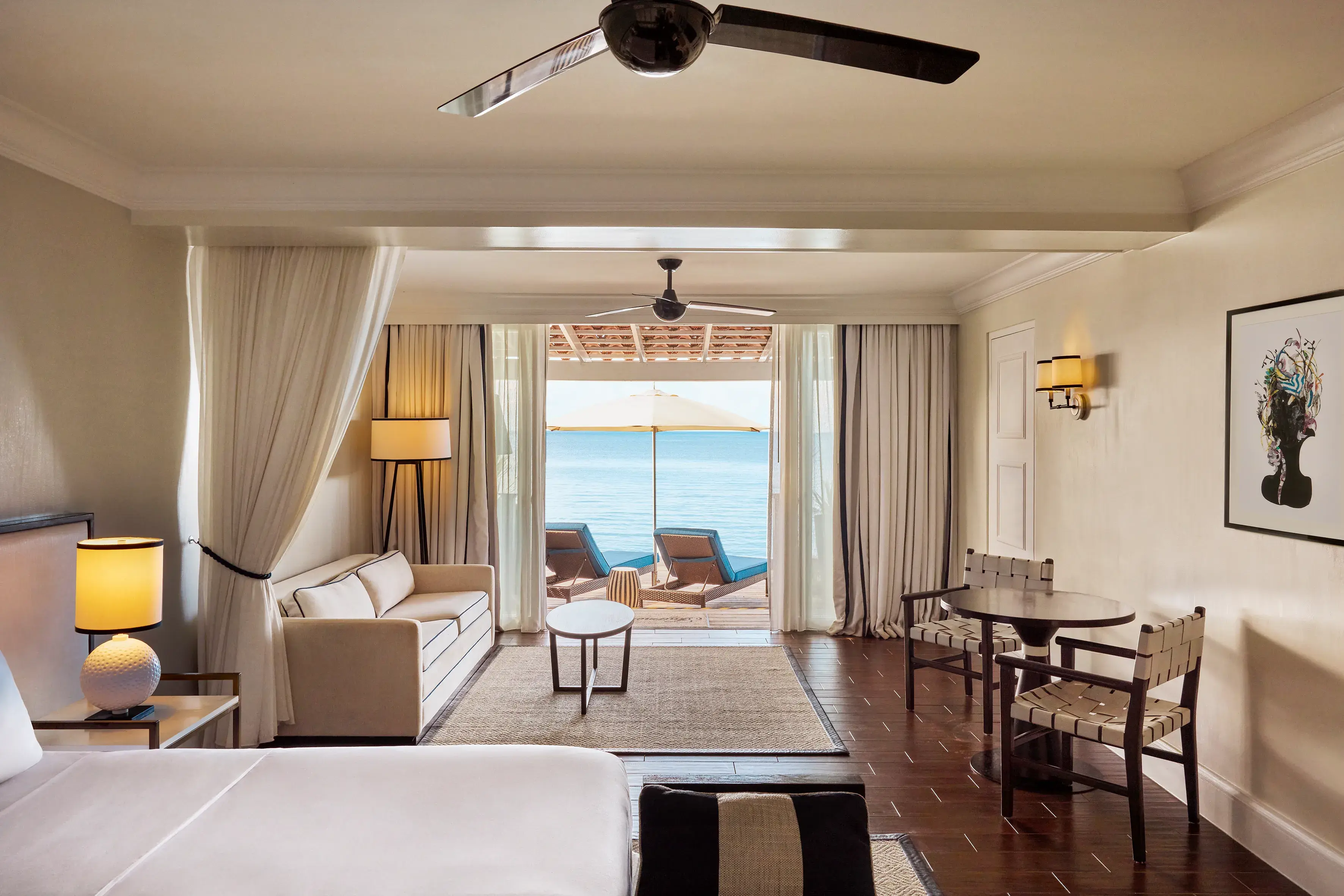 Luxury Beachfront Suite at Fairmont Royal Pavilion in Barbados featuring elegant Caribbean-inspired interiors, a private terrace, and uninterrupted ocean views
