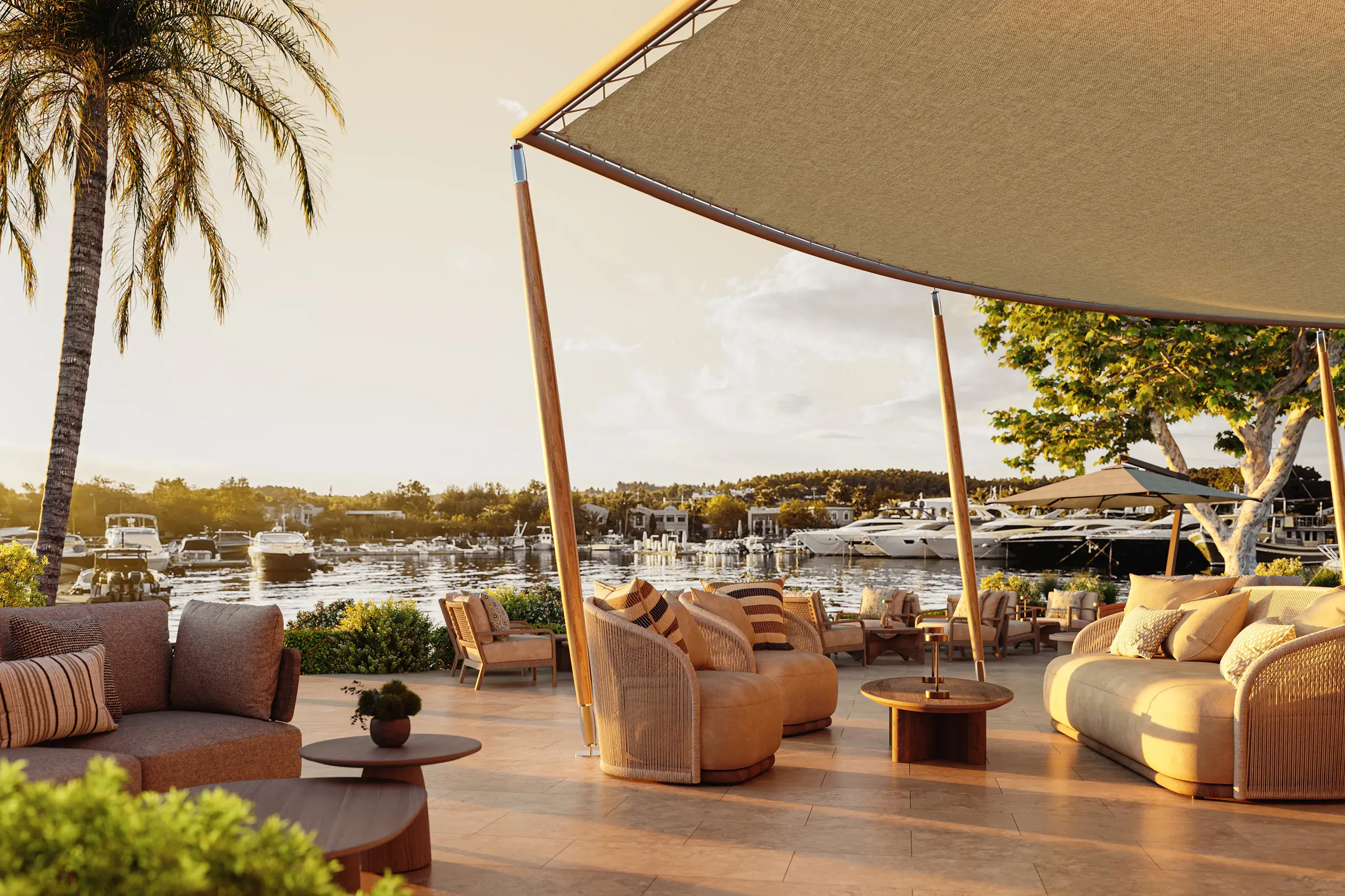 Stylish waterfront Terraz Bar at Sani Asterias in Halkidiki overlooking the marina at sunset with elegant outdoor seating.