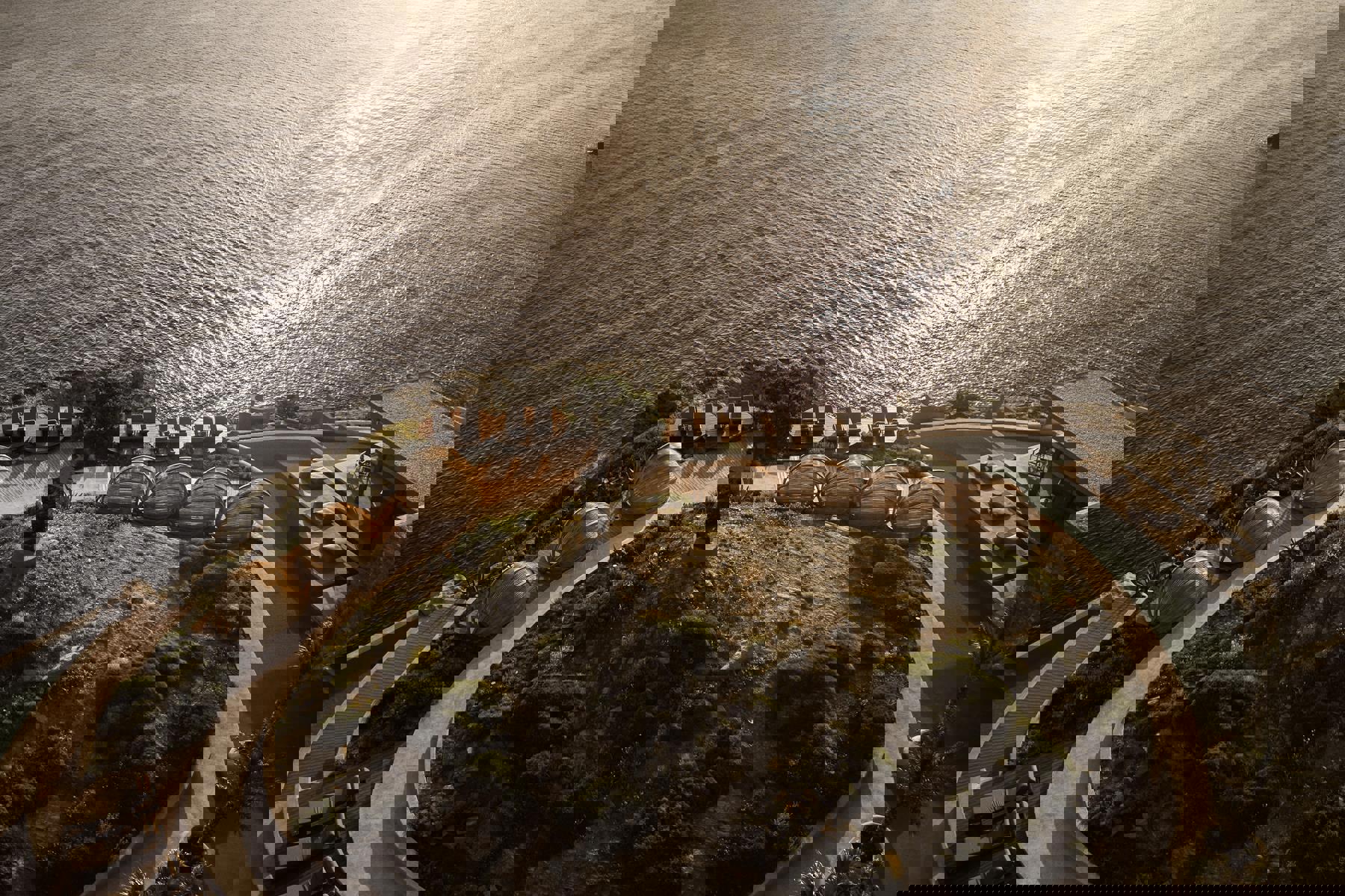 Mirrored obelisk in the centre of the pool at Acro Wellness