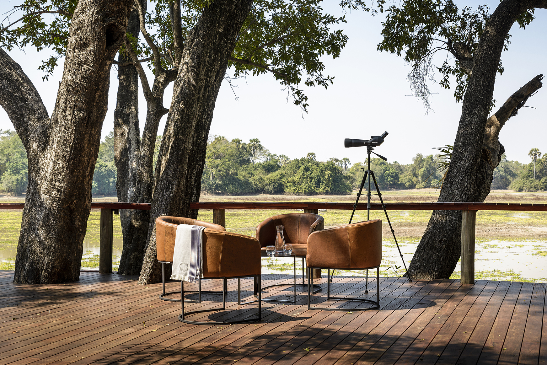 Africa, Zambia, Sungani Lodge, three chairs on the main deck 