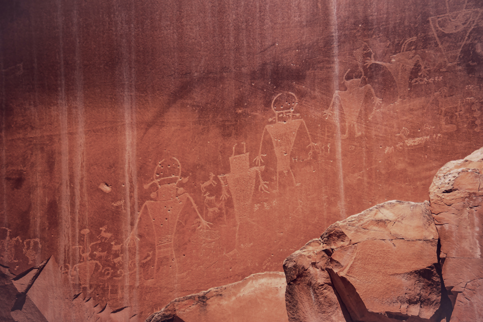 Drawing of people in red rock