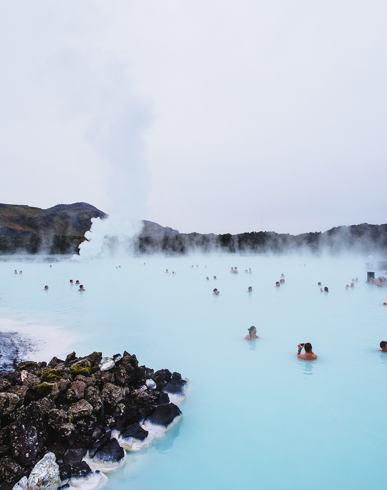 People swimming in a hot blue lagoon